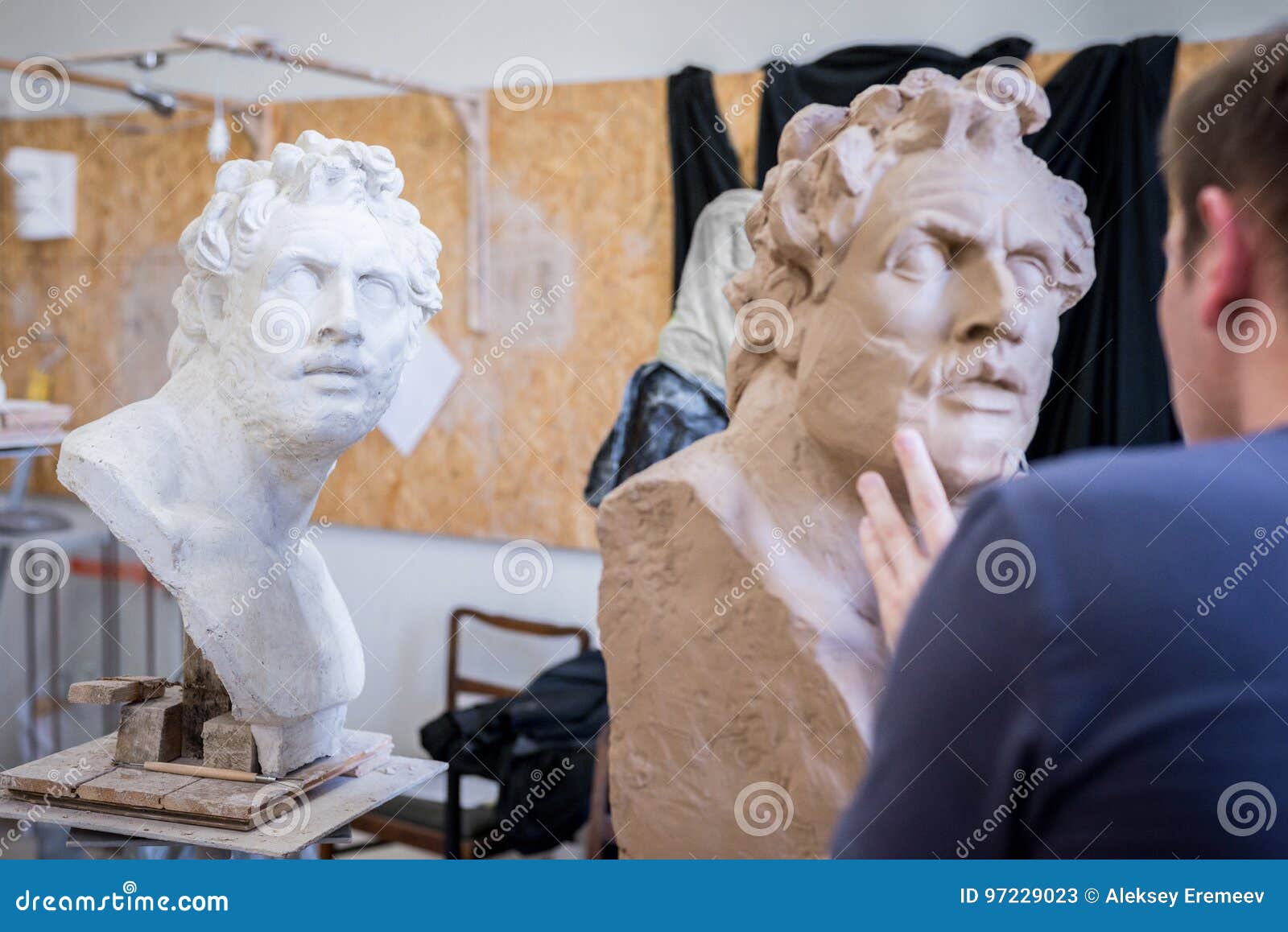 A Sculptor Sculpts a Sculpture of a Person`s Face. Horizontal Frame