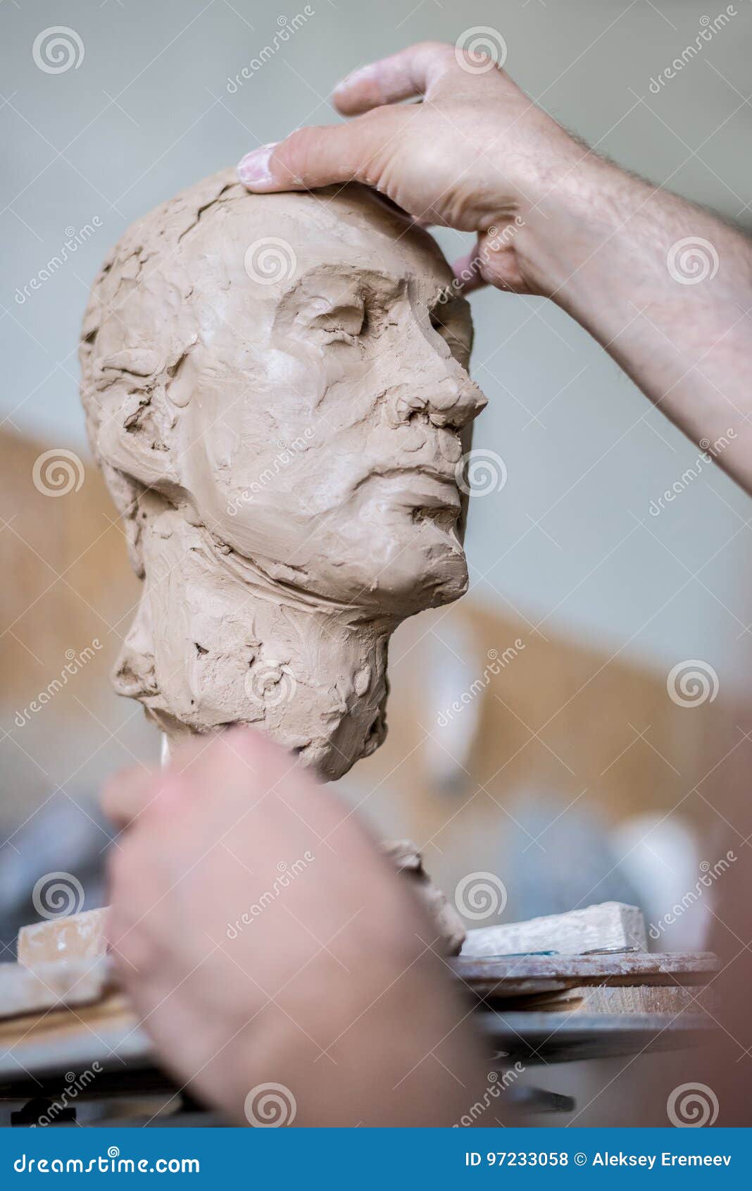 A Sculptor Sculpts a Sculpture of a Person`s Face. Horizontal Frame