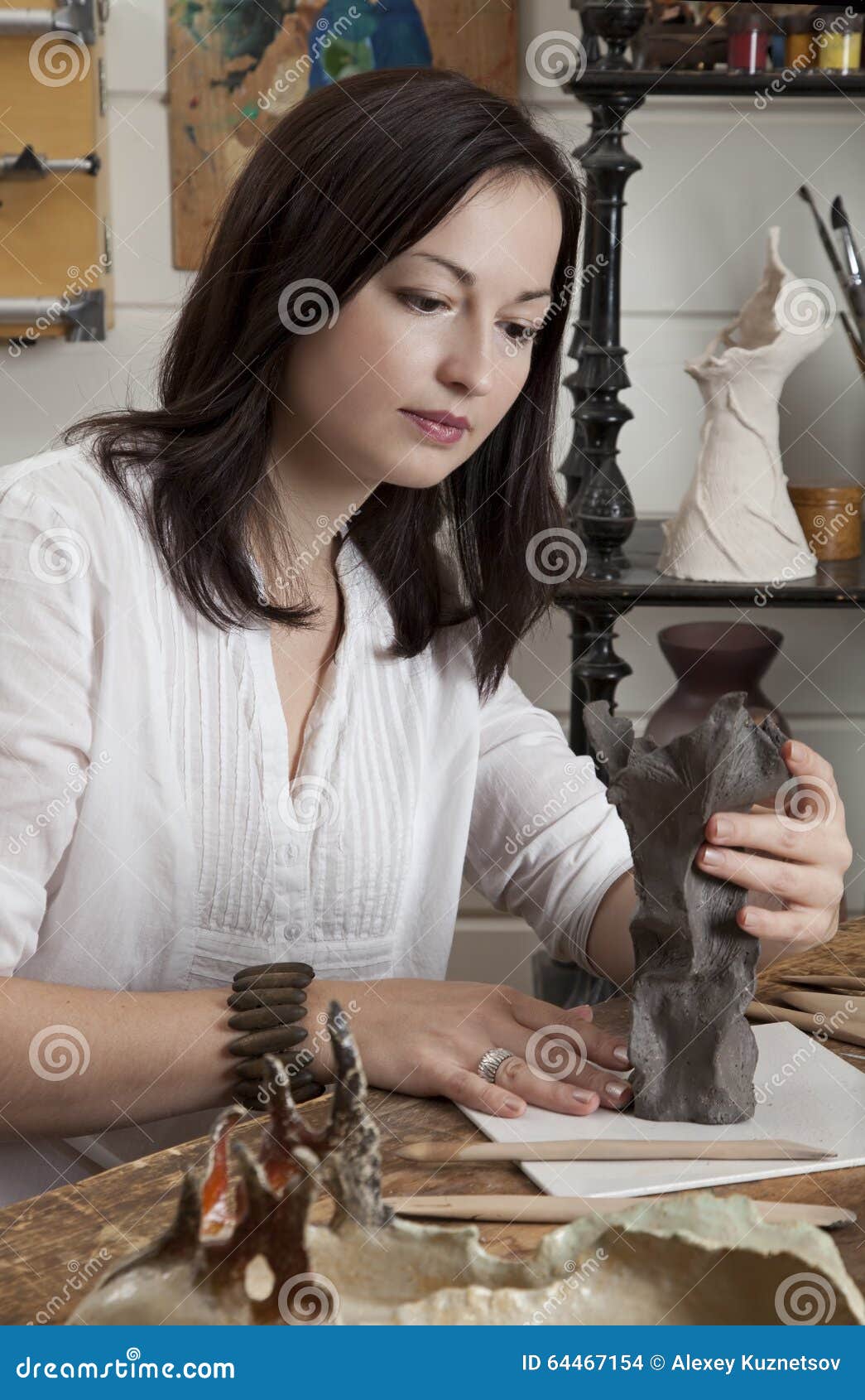 Sculptor working with clay stock photo. Image of occupation 64467154