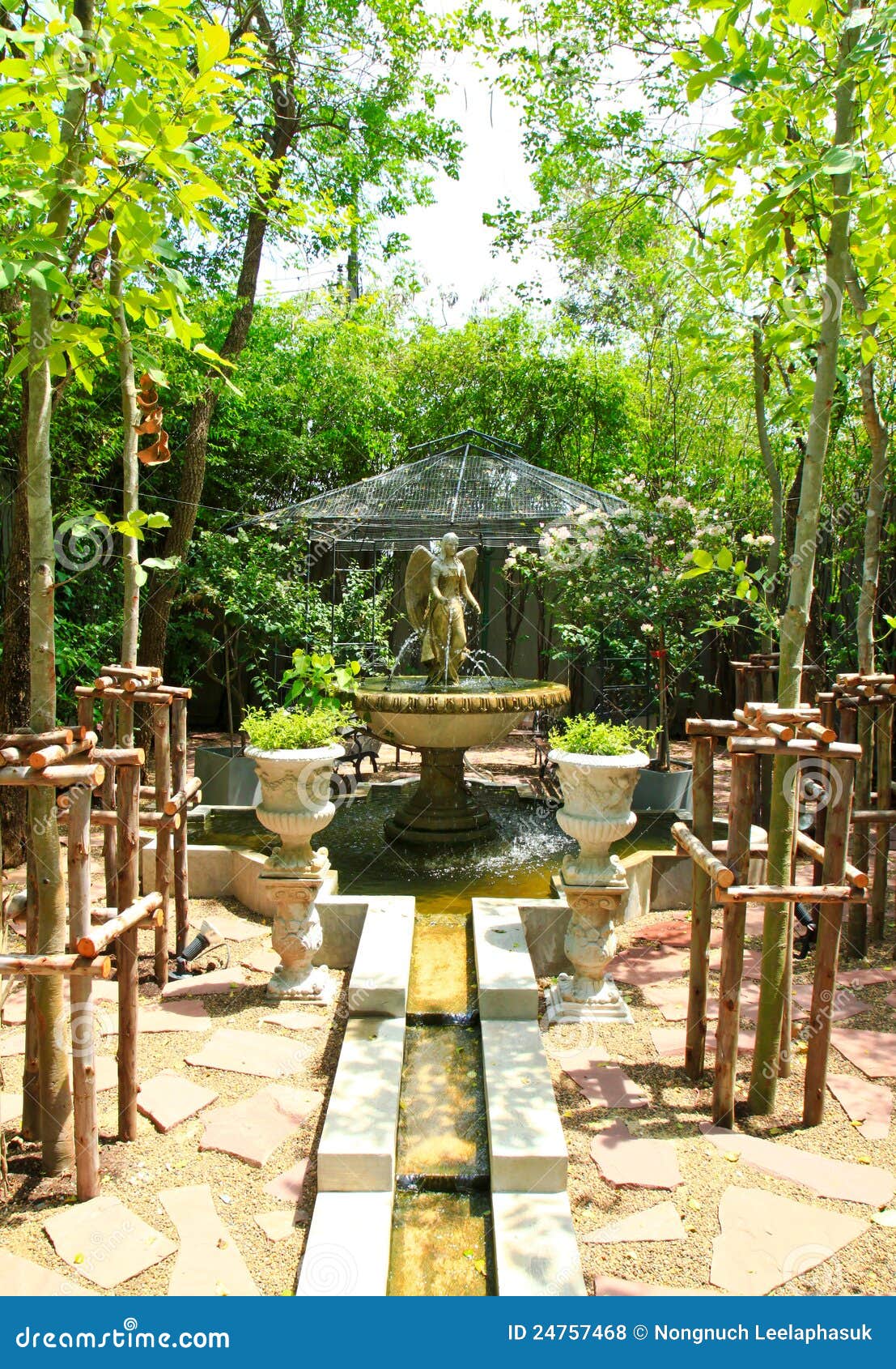 Sculpture Fountain in the Garden Stock Photo Image of bloom, pebble