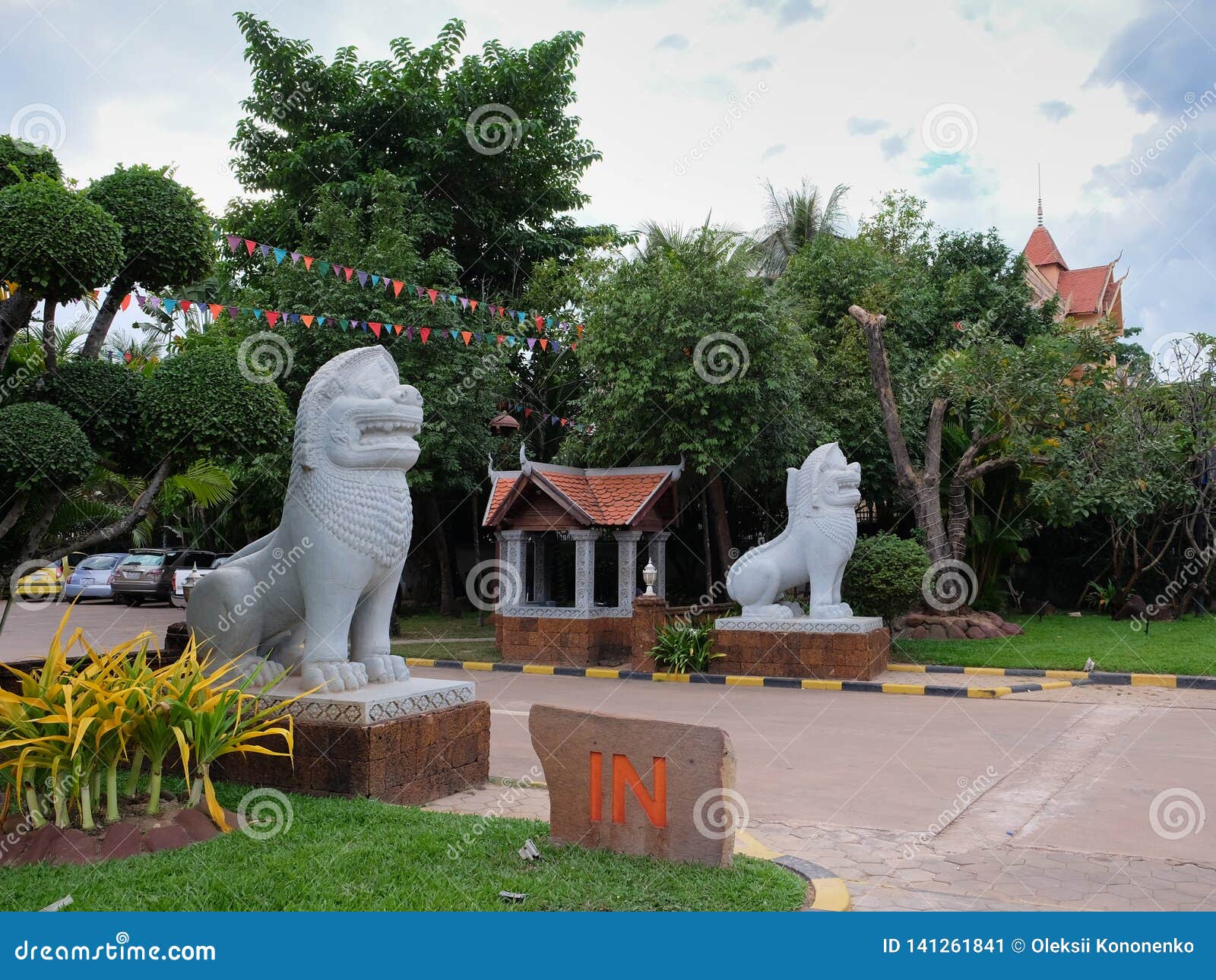 Sculpture Of A Lion In Front Of The Entrance To The City Park