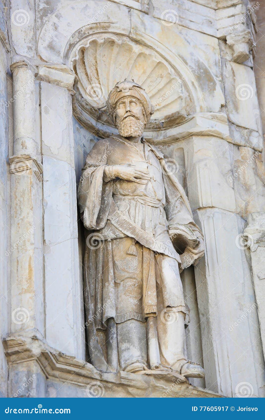sculpture of a saint at se velha or old cathedral, coimbra