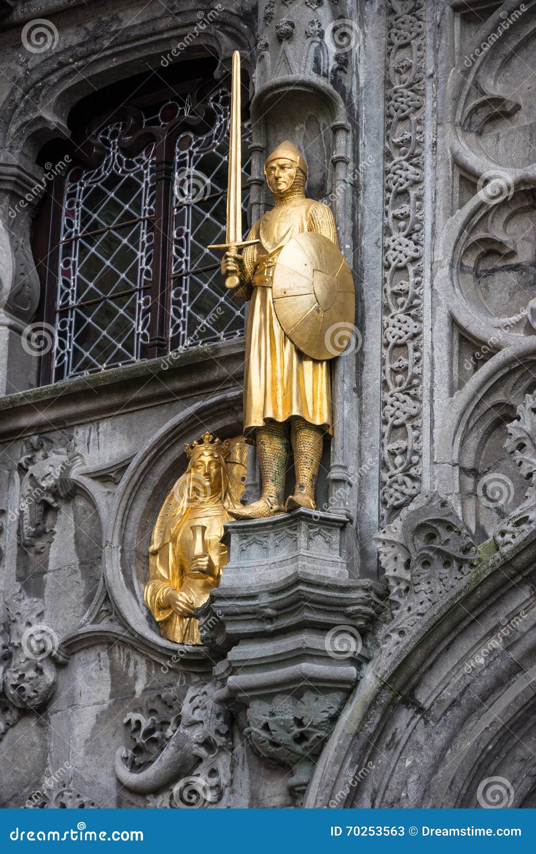 sculptures of crusaders on the walls of basilica of the holy blood. brugge, belgium