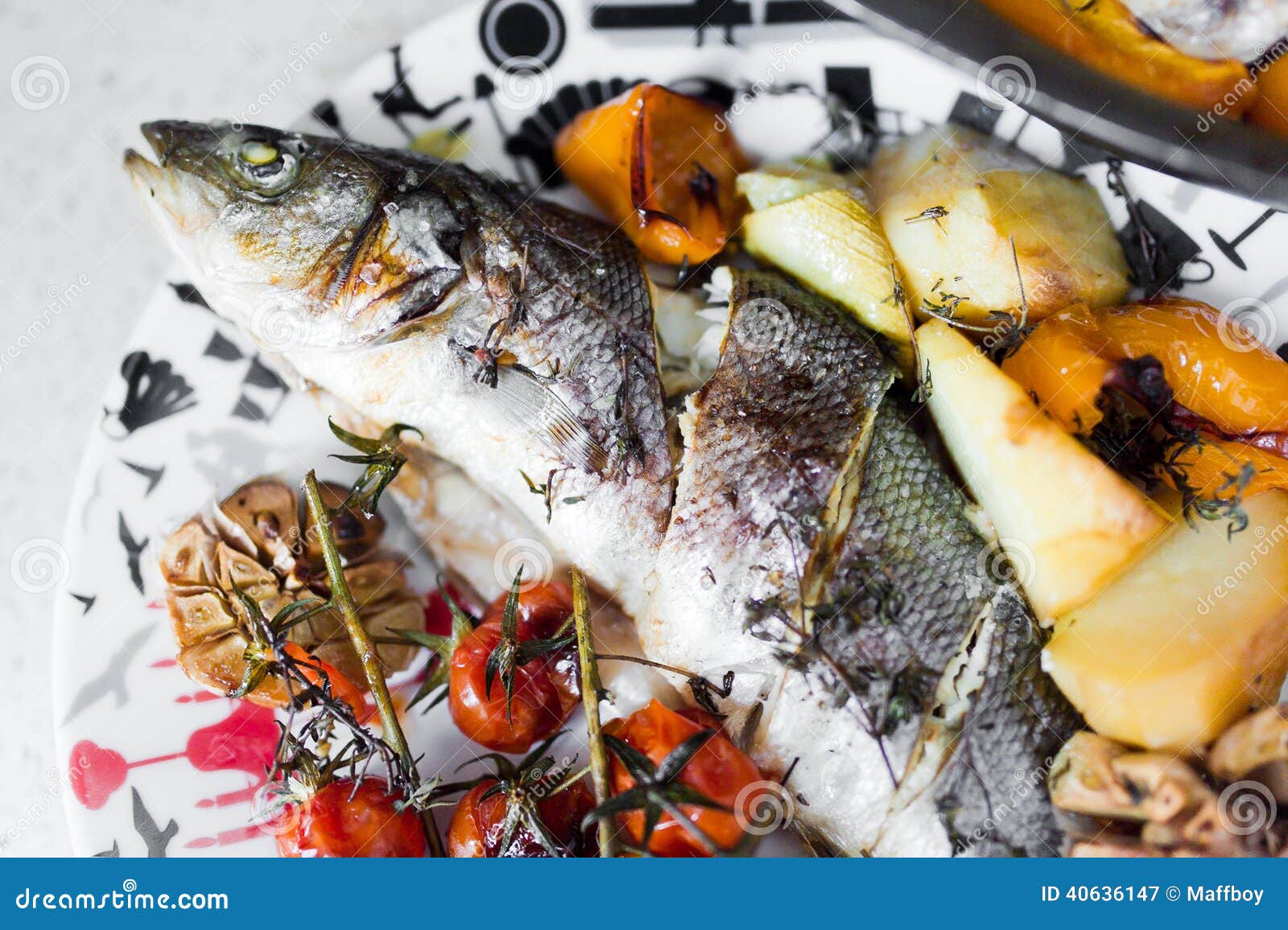 Sea bass with vegetables stock image. Image of green 40636147