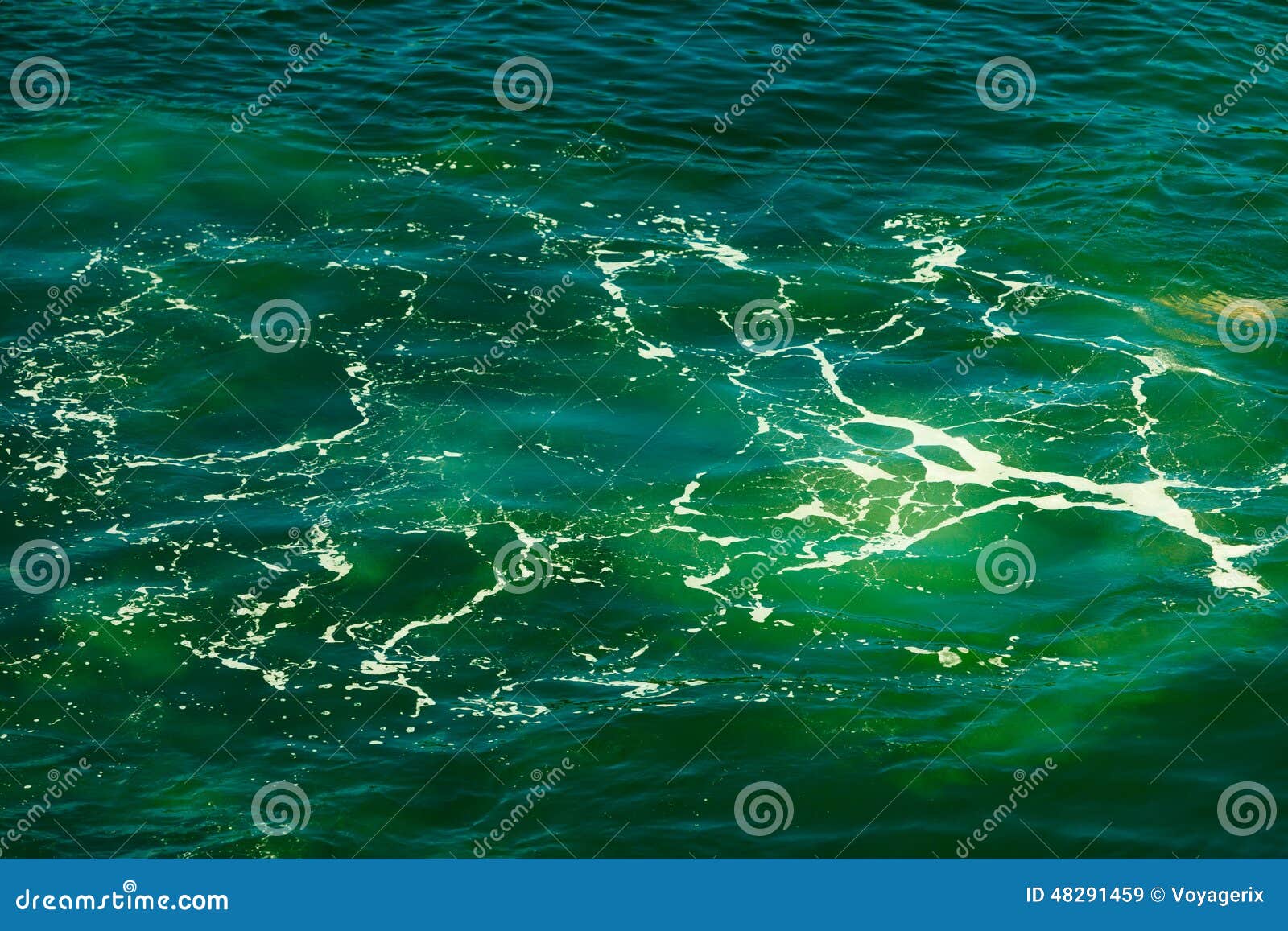 Sea bottom with blue water wave splash background. Sea with blue green water wave splash background