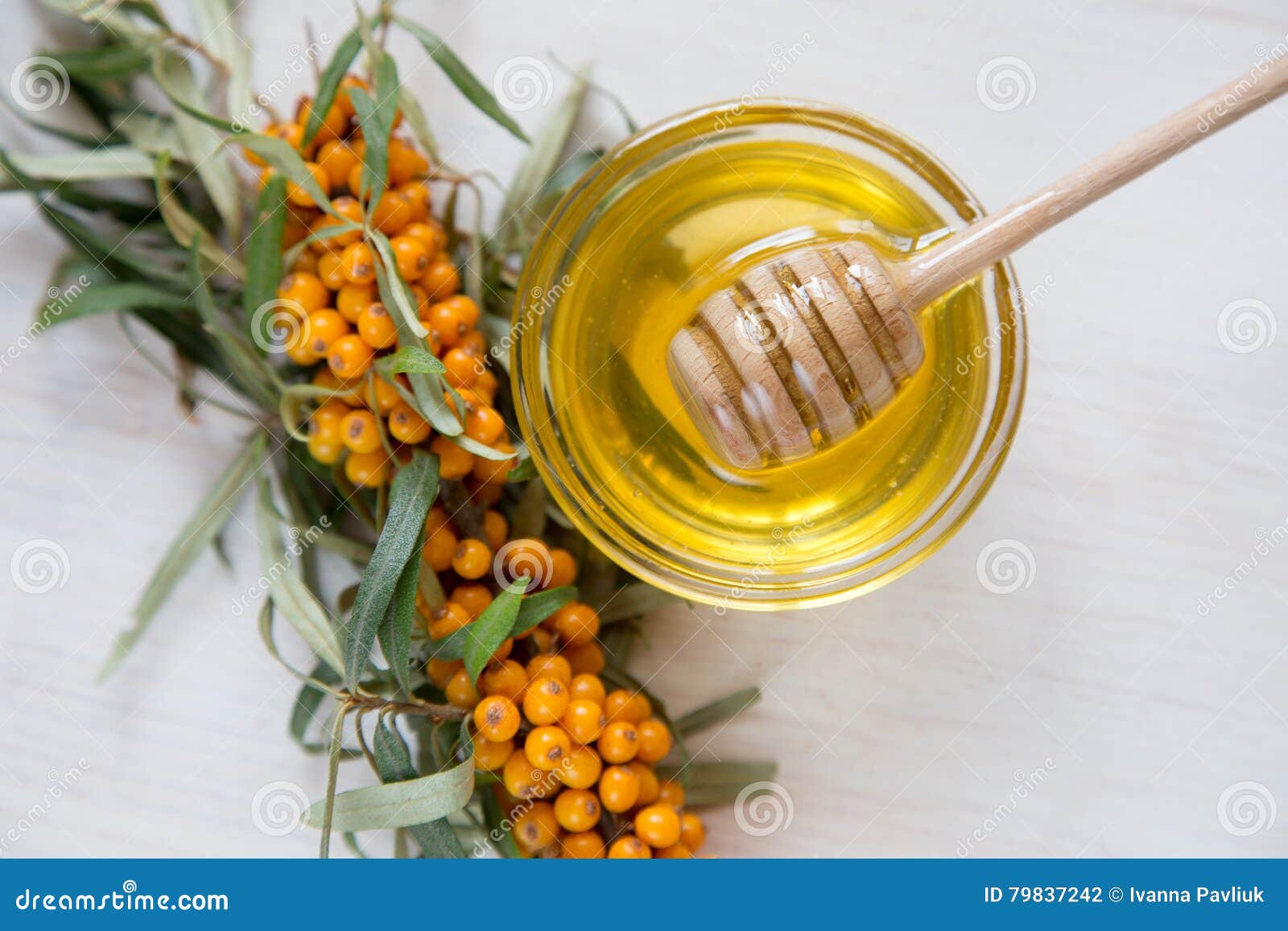 Sea Buckthorn and Honey on a Light Background. Selective Focus Stock