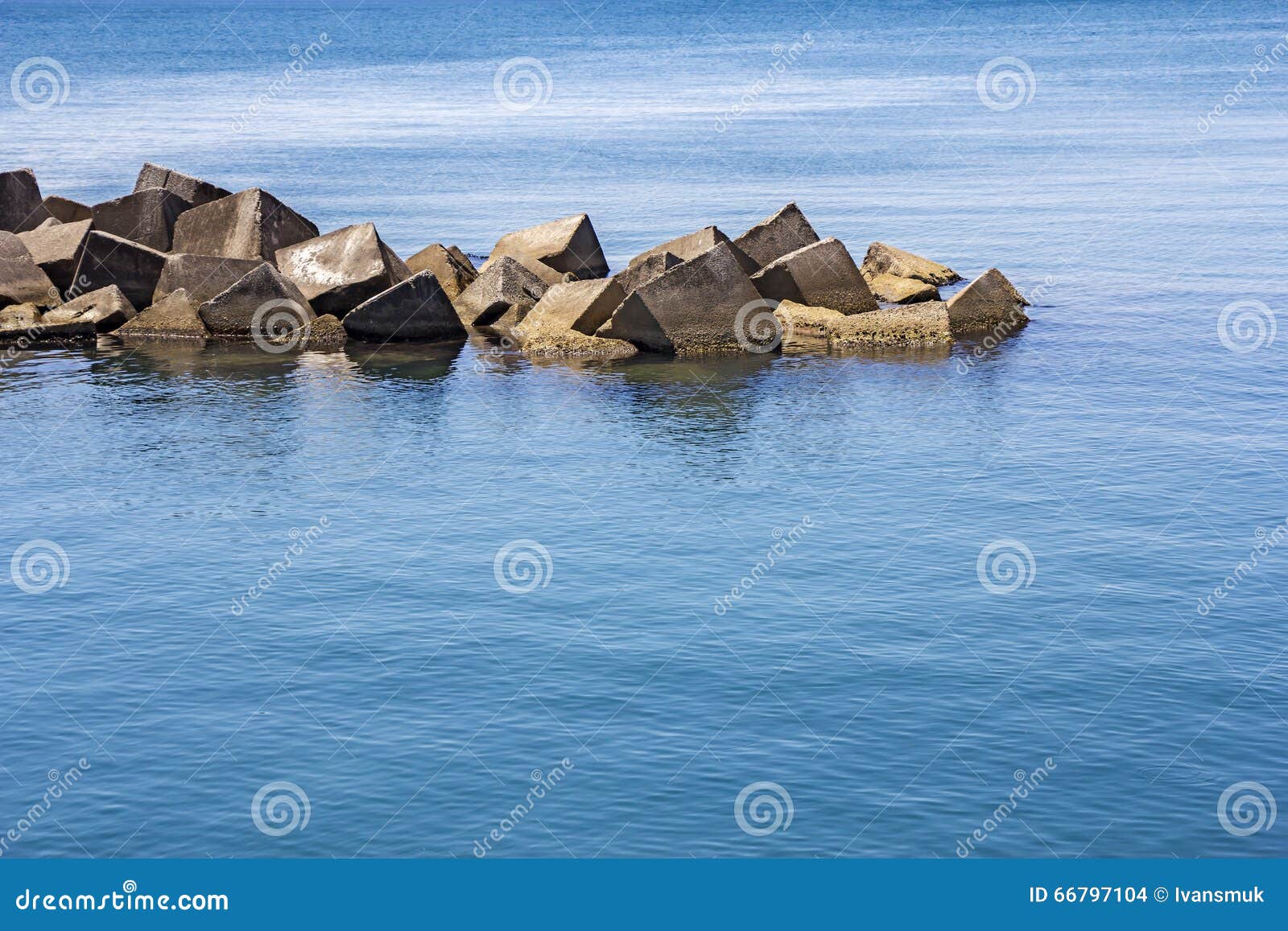 Sea concrete block dam stock photo. Image of shore, island 66797104
