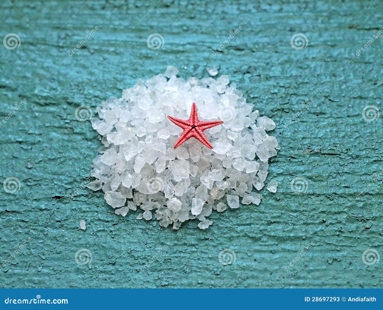 Sea salt with starfish on wooden background, close-up