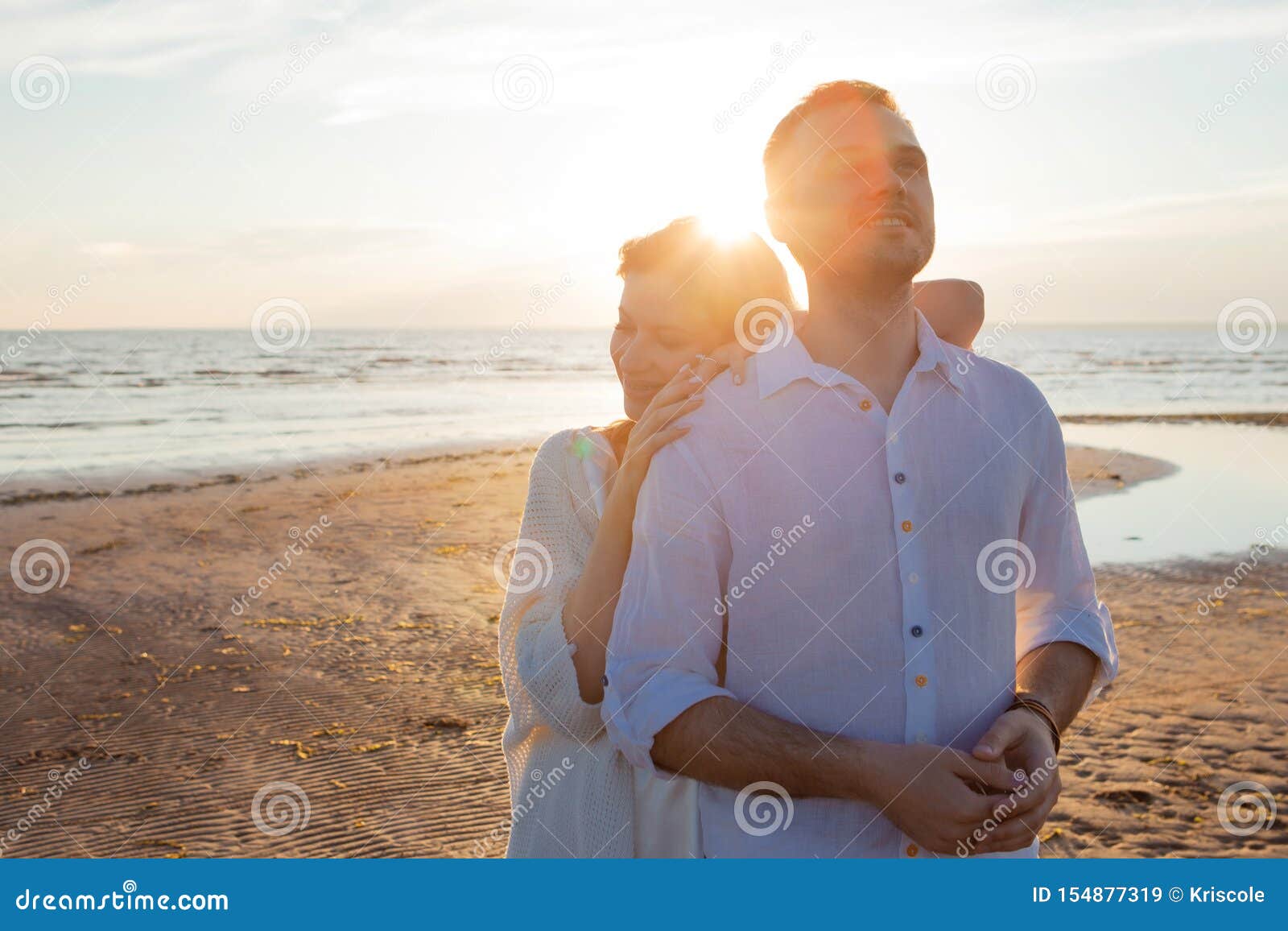 Sea of Tranquility. a Happy Couple is Embracing Tenderly Against the