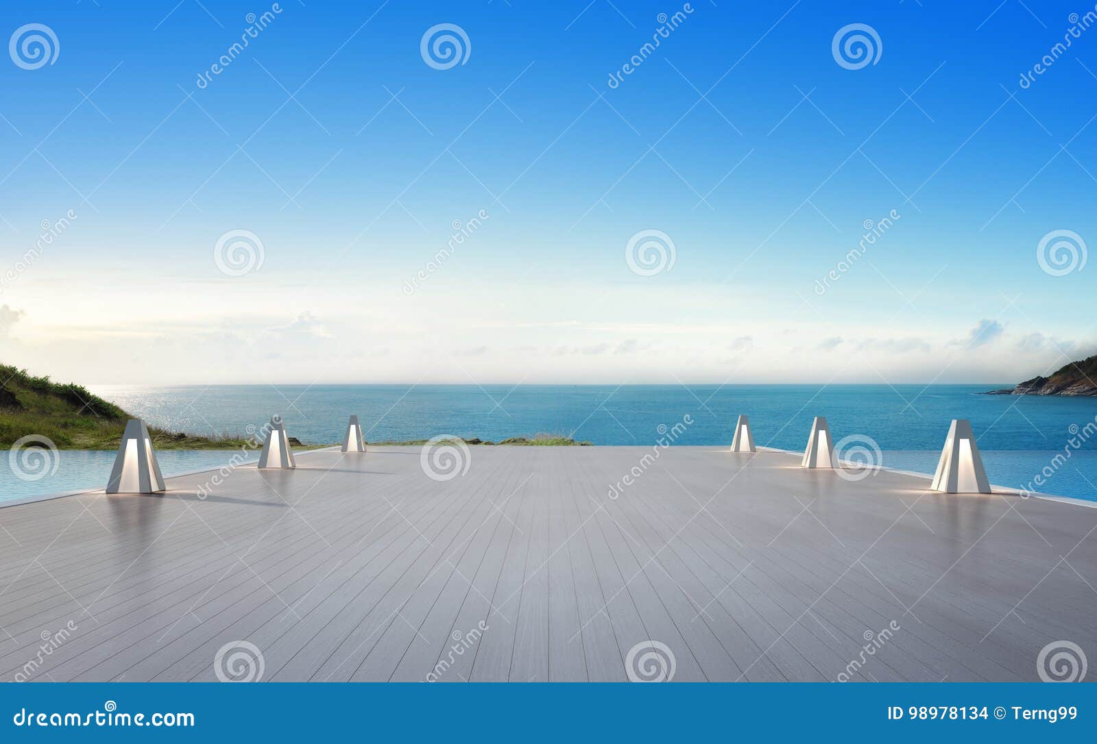 sea view swimming pool and empty big terrace in modern luxury beach house with blue sky background, lamps on large wooden deck