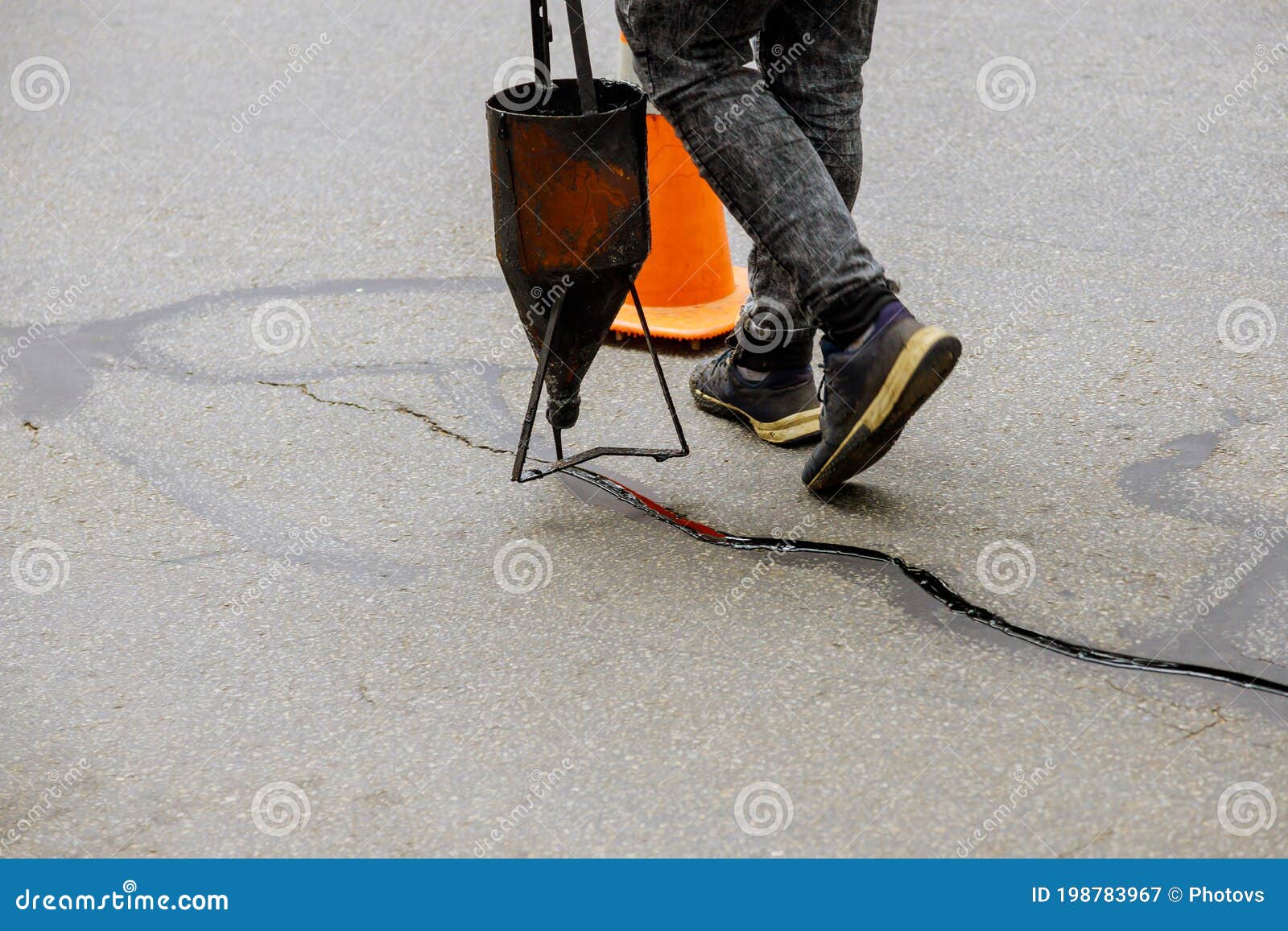 Sealing Joint Crack in Asphalt Road Surface Restoration Work Stock