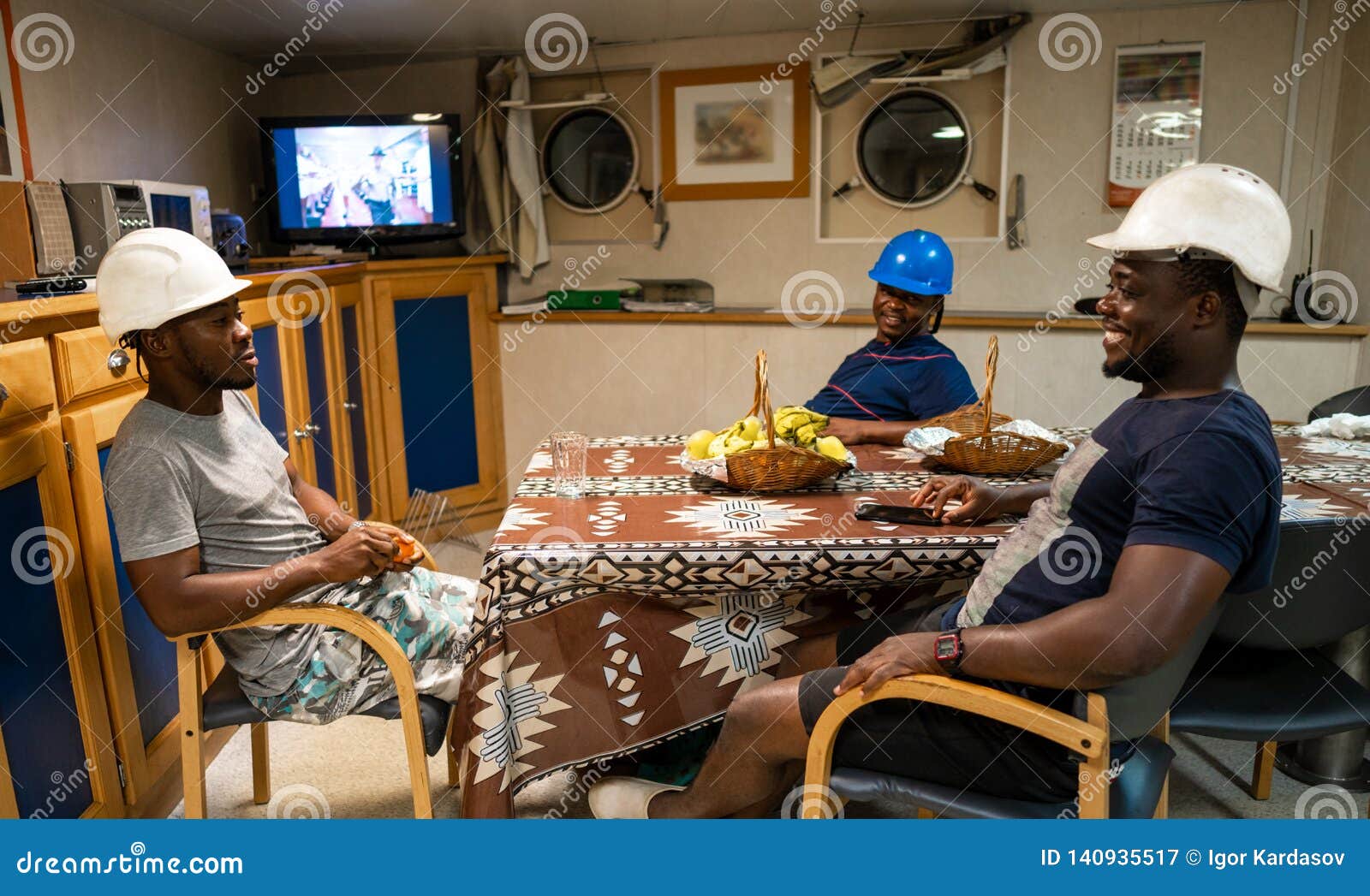 seamen crew onboard a ship or vessel having fun watching tv