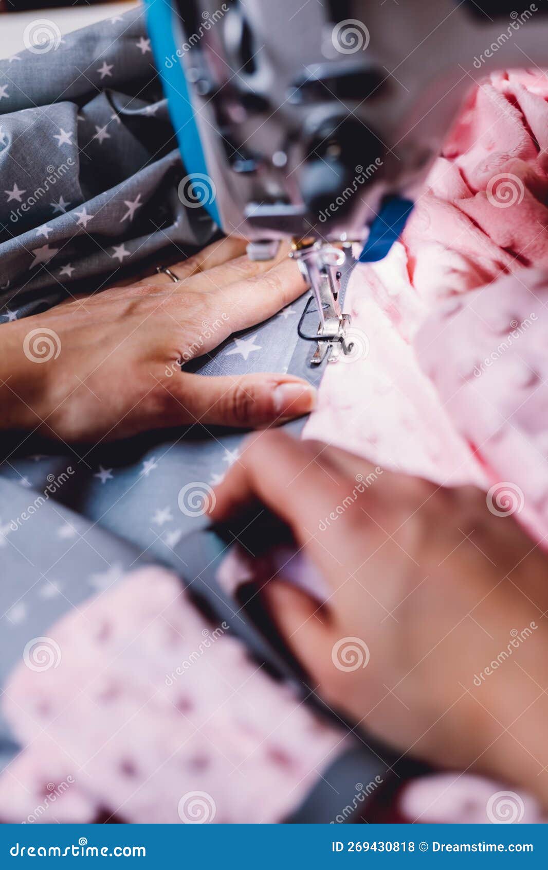 Seamstress Dressmaker Working with Sewing Machine in Stock