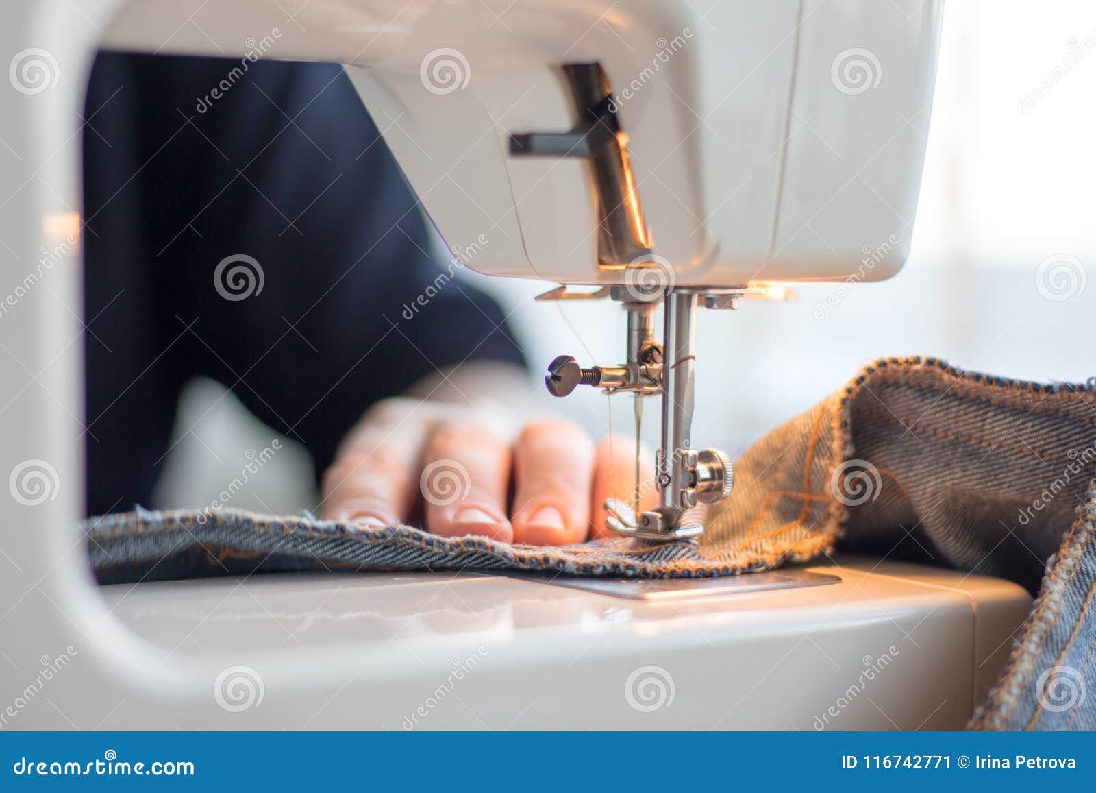 Seamstress Hands Working on a Sewing Machine Stock Image Image of