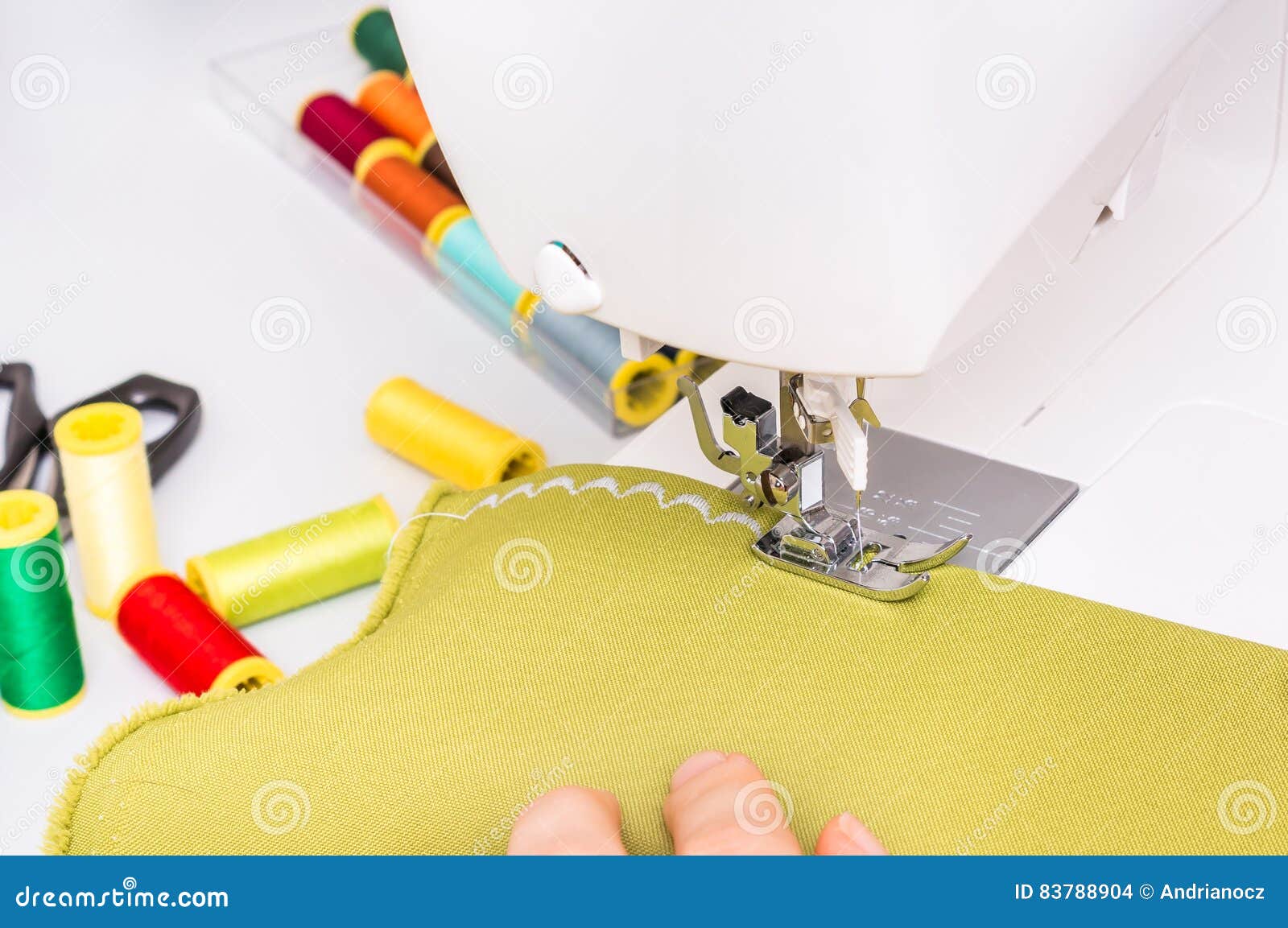 seamstress is sewing on sewing machine