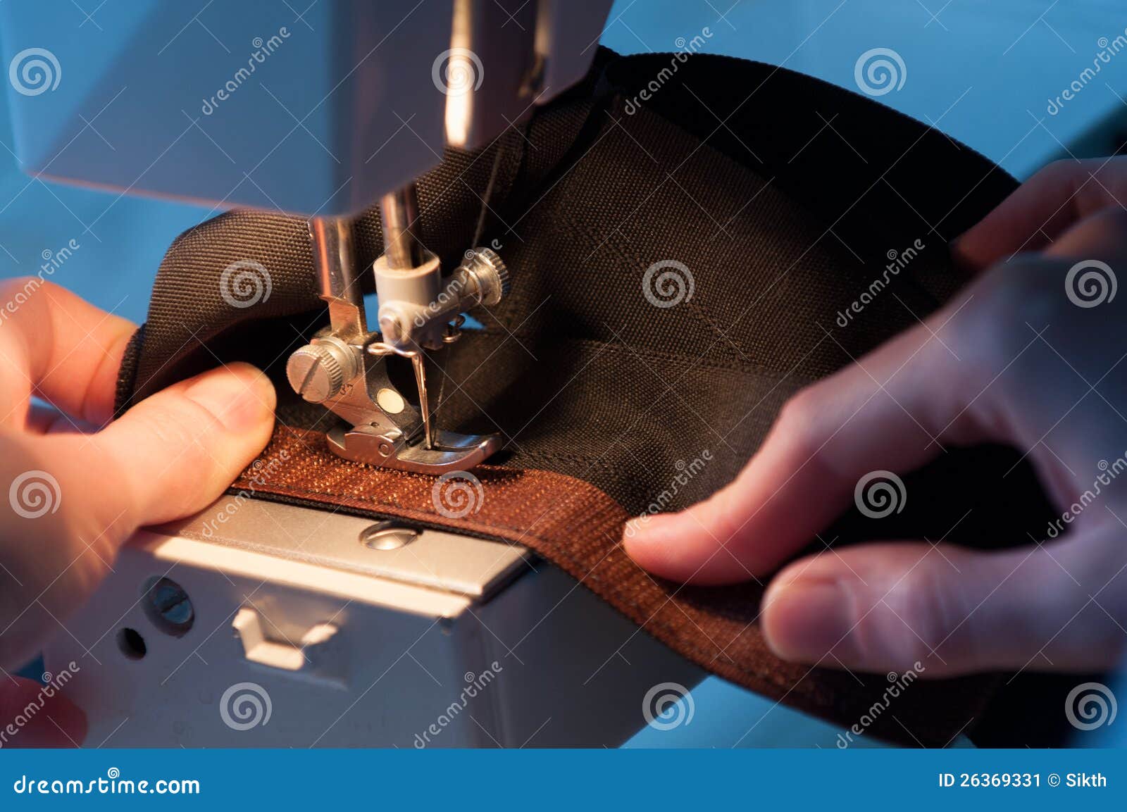 seamstress sewing on velcro hook-and-loop fastener