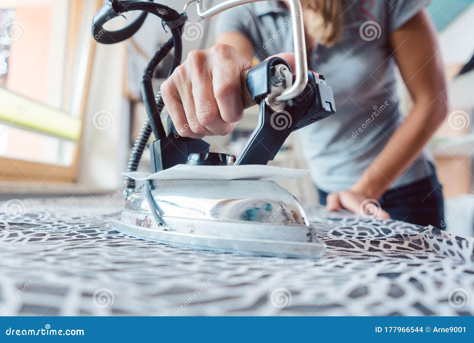 Tailor ironing fabric stock photo. Image of textile 177966544