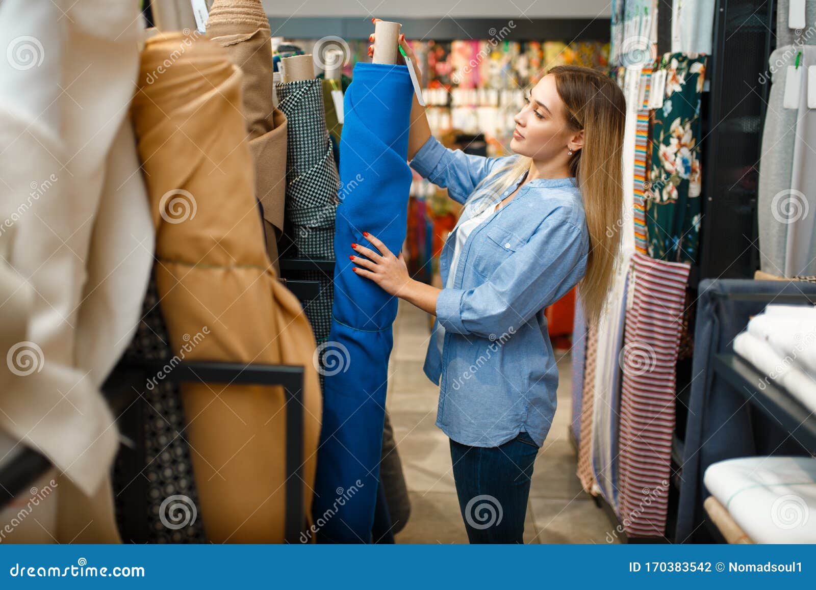 https://thumbs.dreamstime.com/z/seamstress-takes-fabric-roll-textile-workshop-woman-works-cloth-sewing-female-tailor-workplace-dressmaker-170383542.jpg