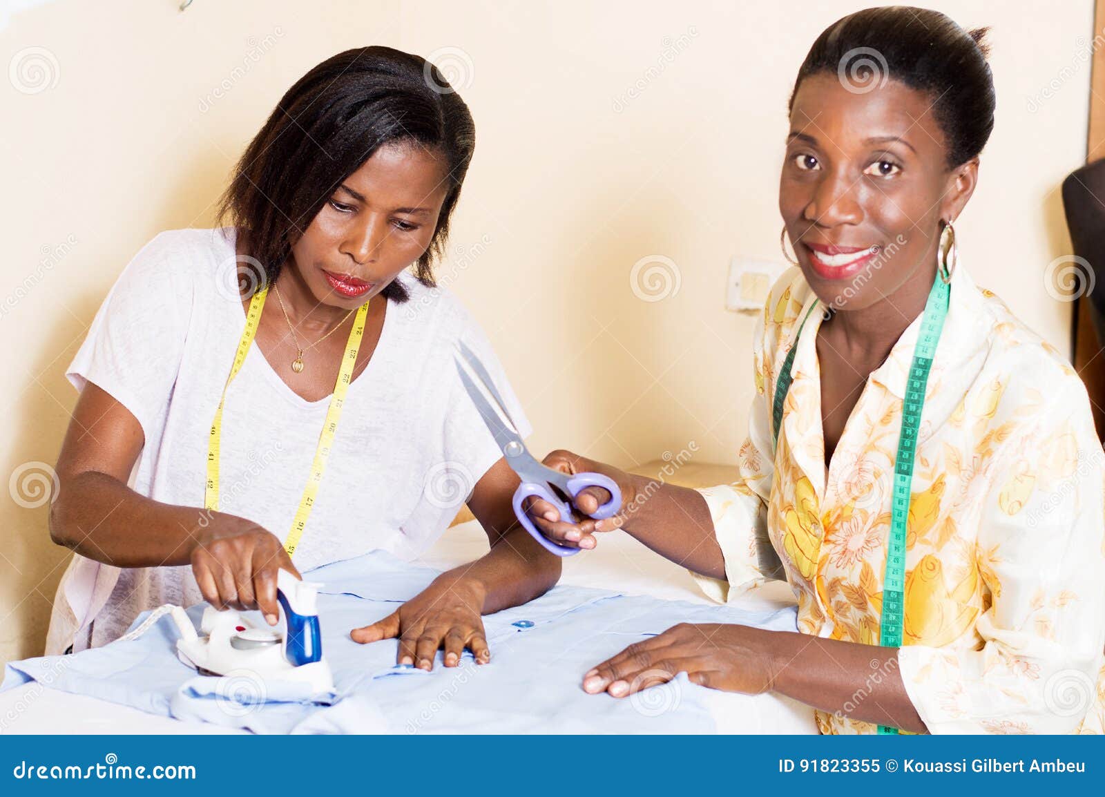 African Woman Seamstress Ironing Cloth Stock Photo, Picture and