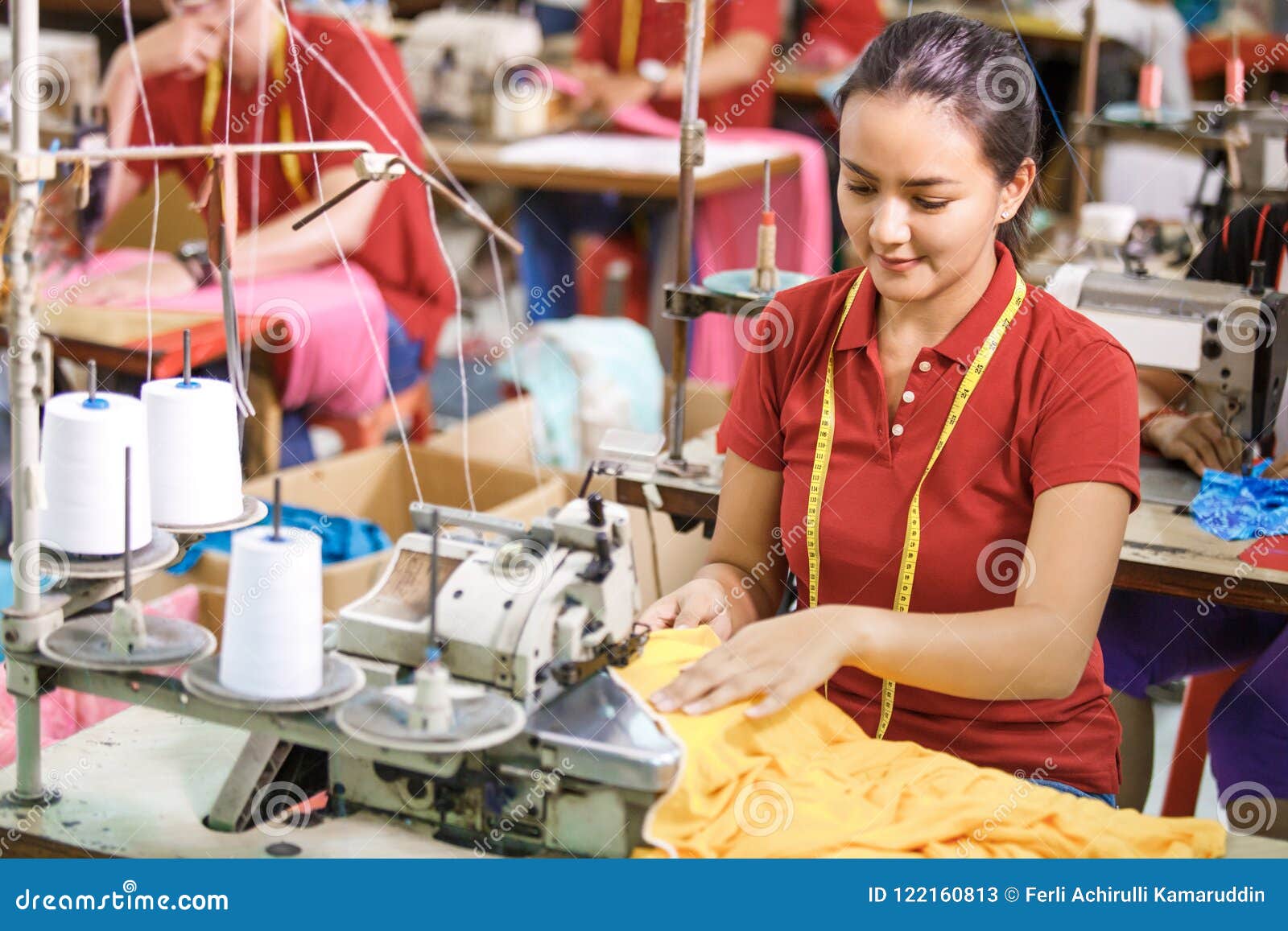 Seamstress in Textile Factory Sewing with Industrial Sewing Mach Stock ...