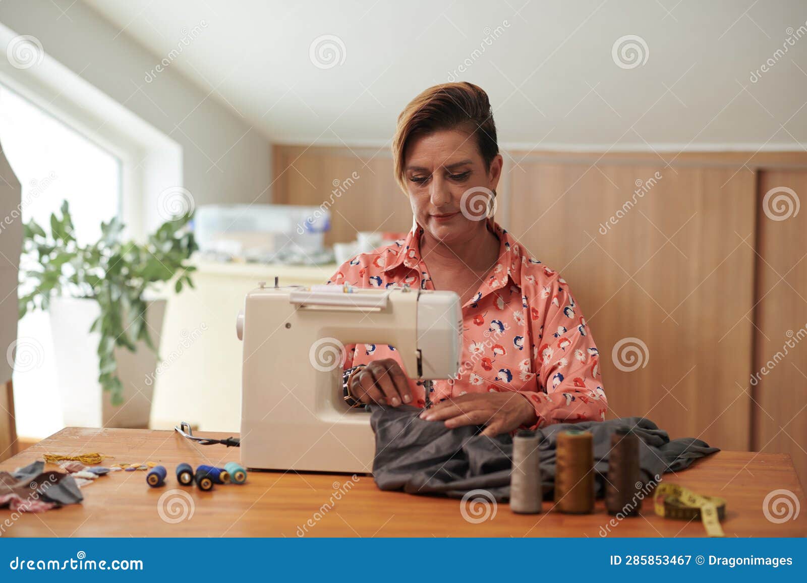 Seamstress Using Sewing Machine Stock Image Image of craftsperson