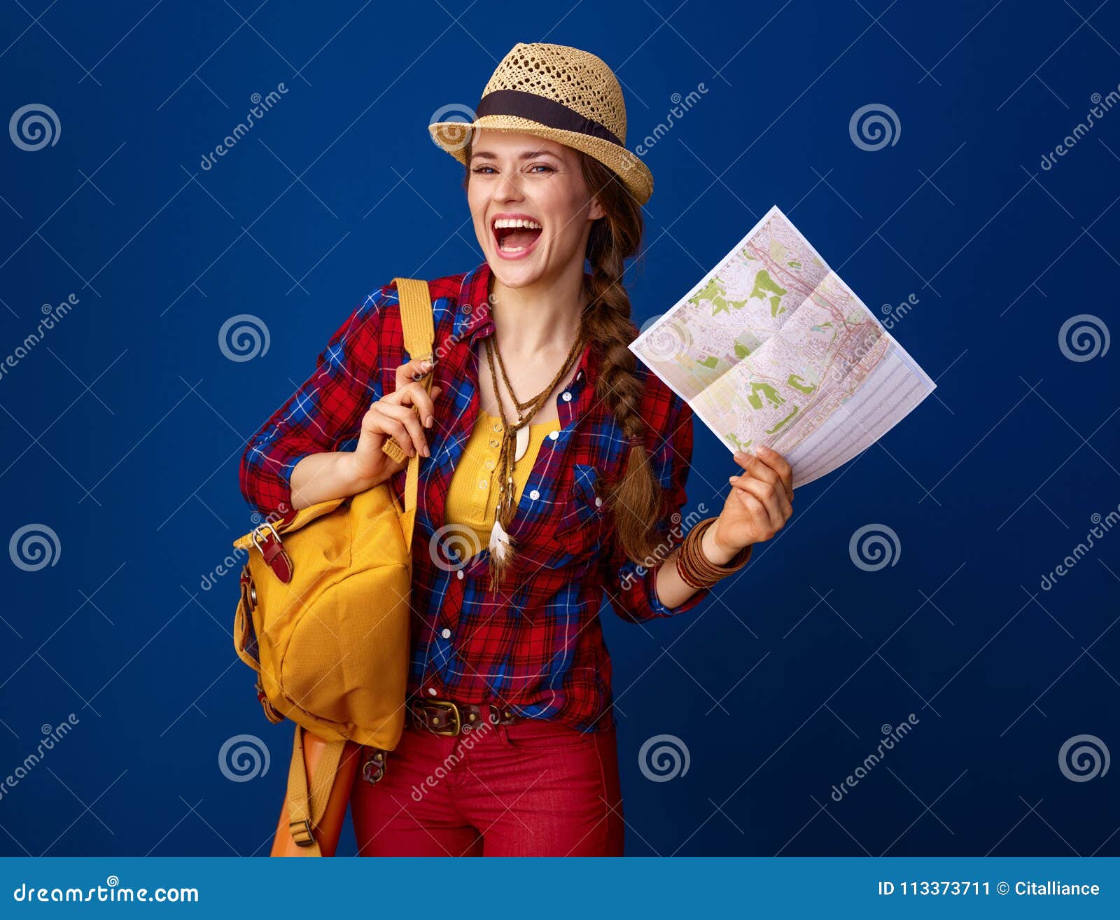 happy traveller woman  on blue background with map