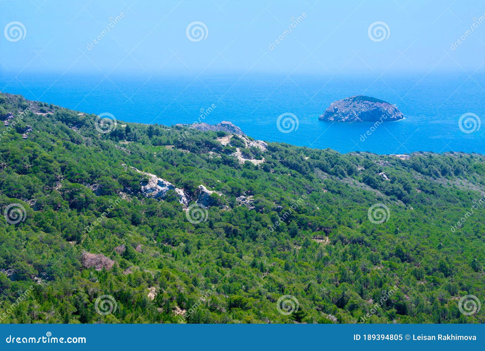 seascape with mediterranien sea, rocks and trees on sunny summer day. summer vacation