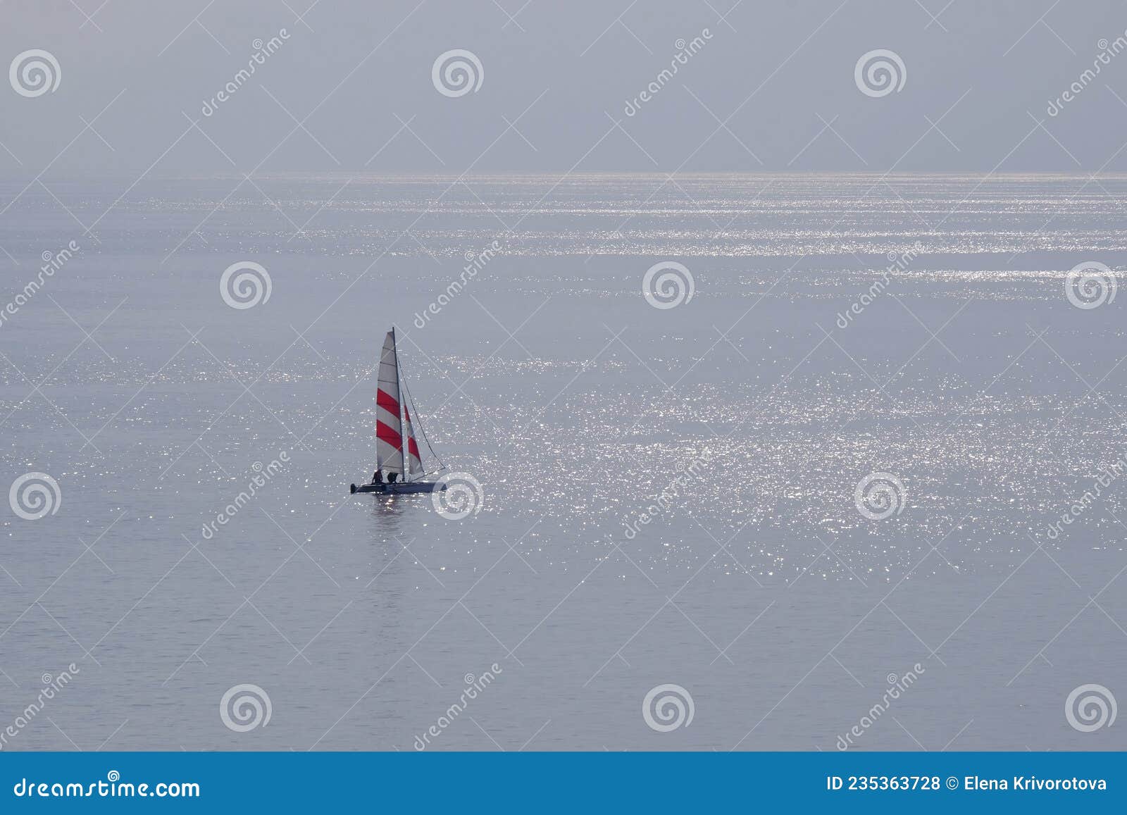 seascape with a sailboat during calima on the canary islands
