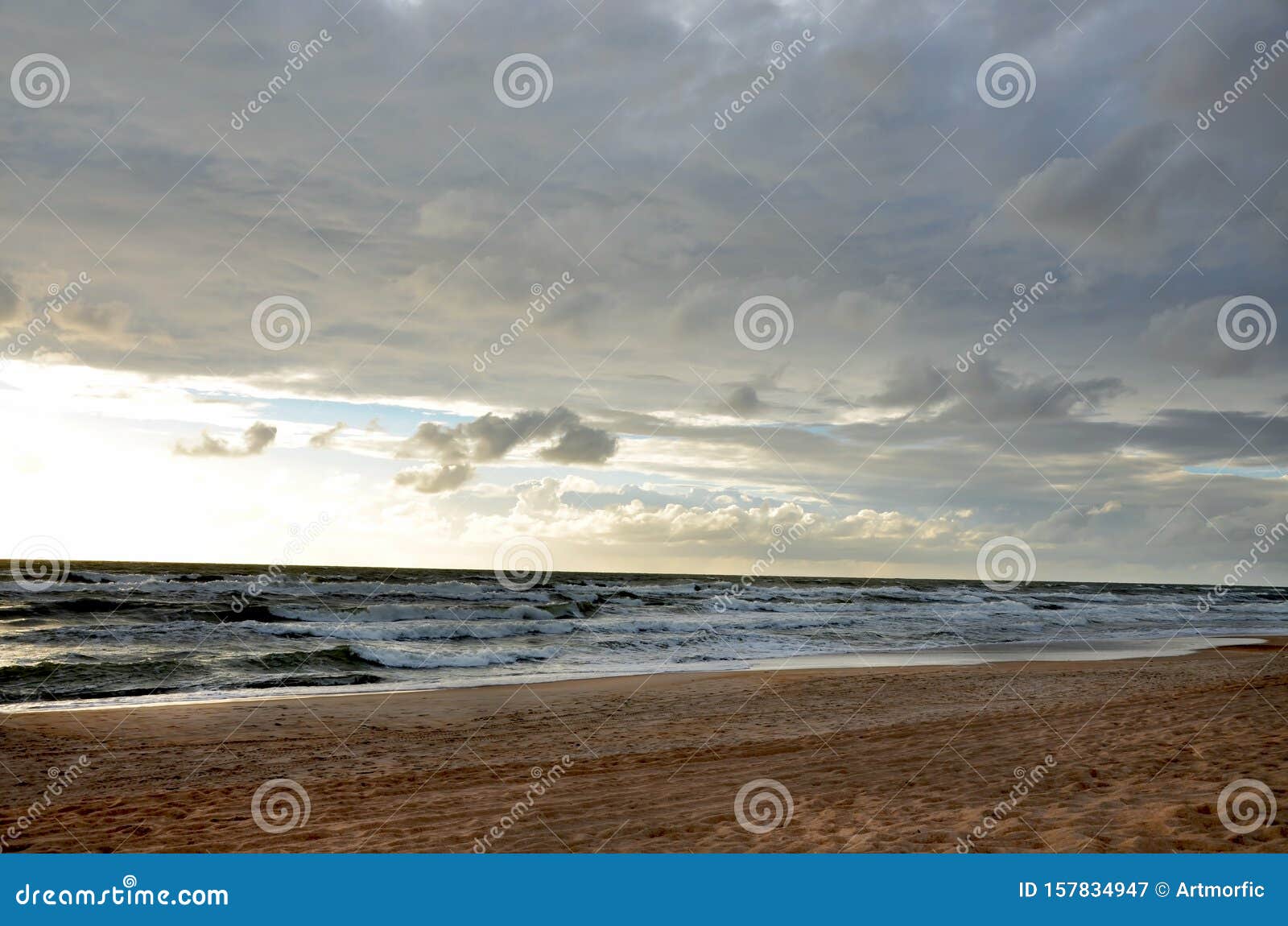 Seashore Sky Blue Tones Dark Heavy Clouds And Sea Waves Sand Beach