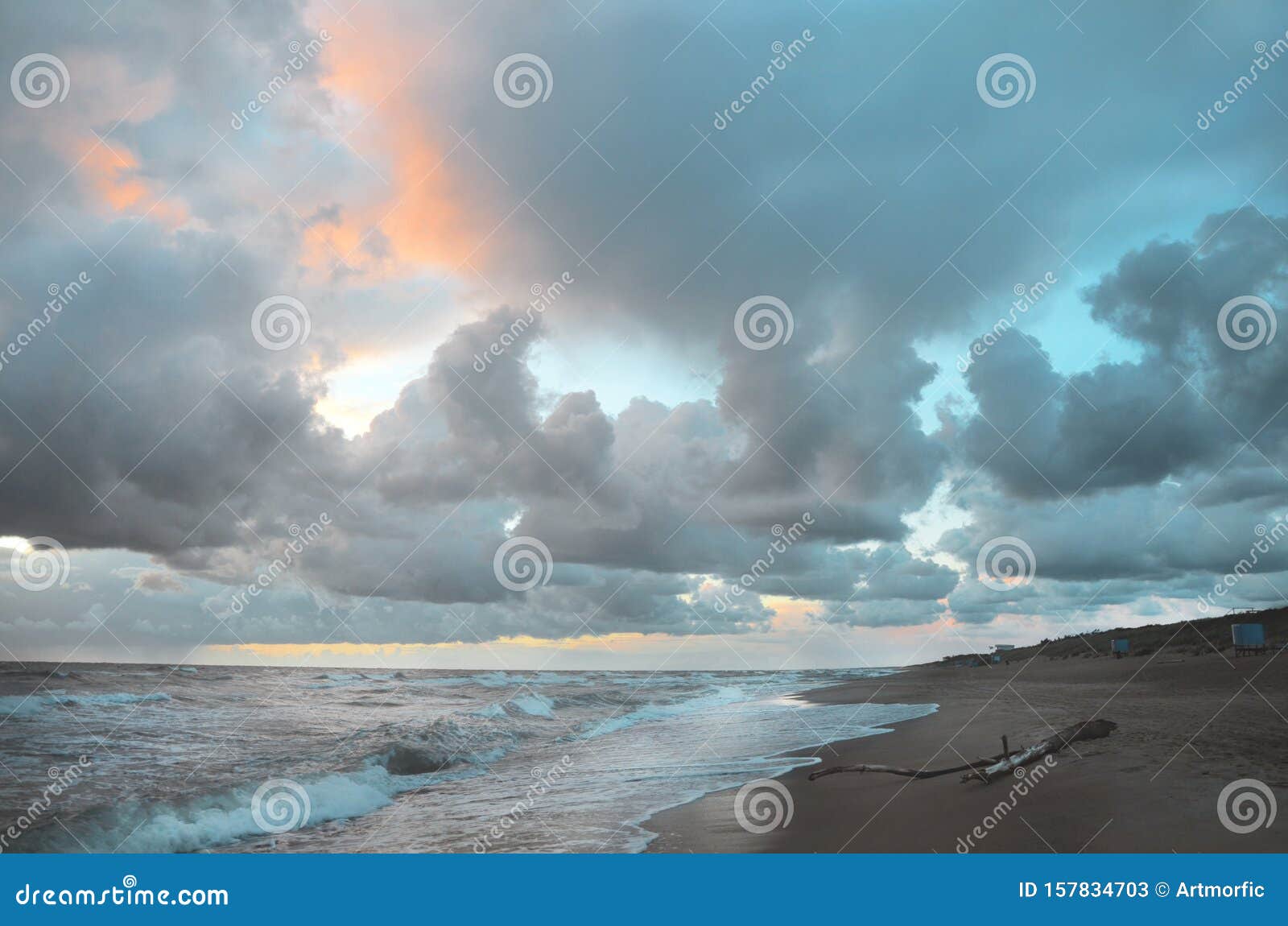 Seashore Sky Orange And Blue Tones Clouds And Sea Waves Sand Beach With