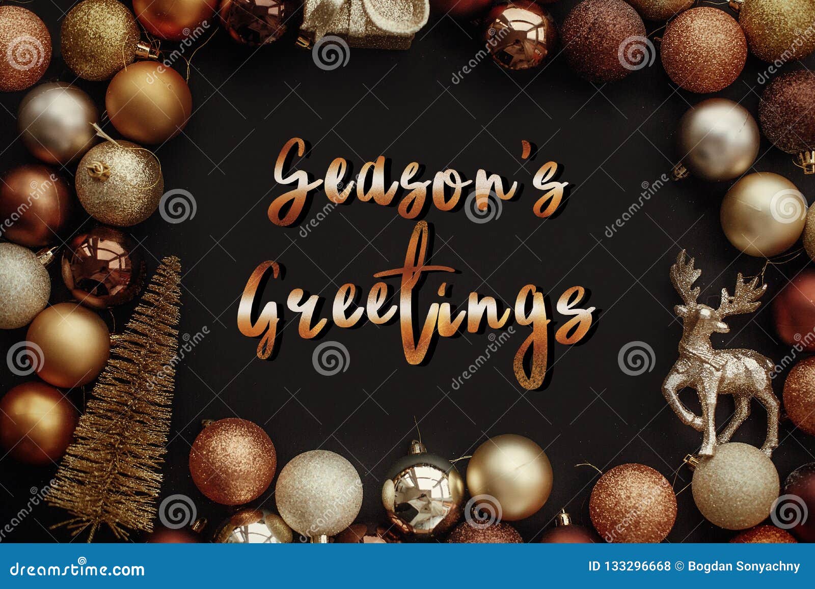 season`s greetings text, handwritten golden sign at christmas go