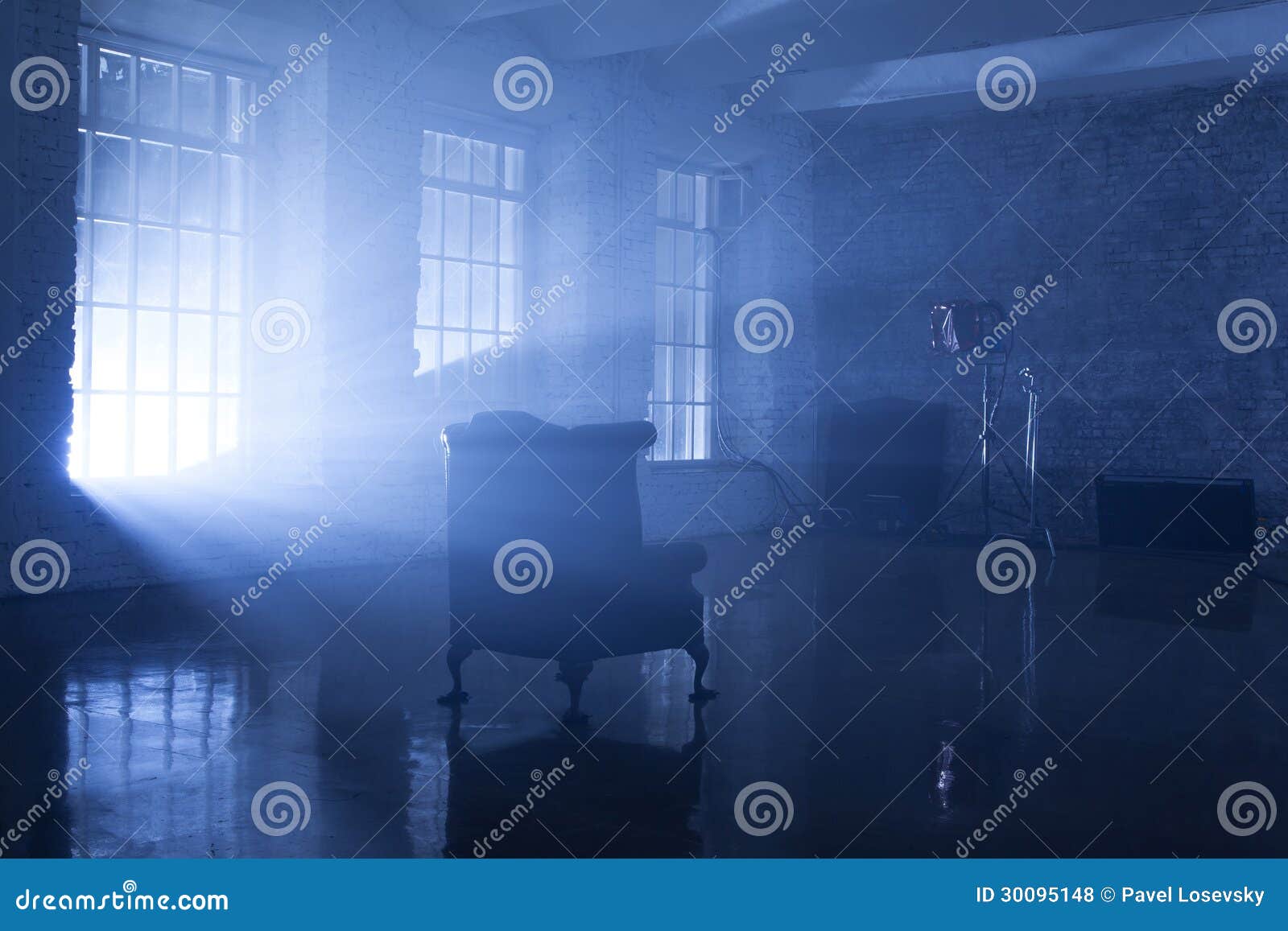 a seat in a blue backlight in studio