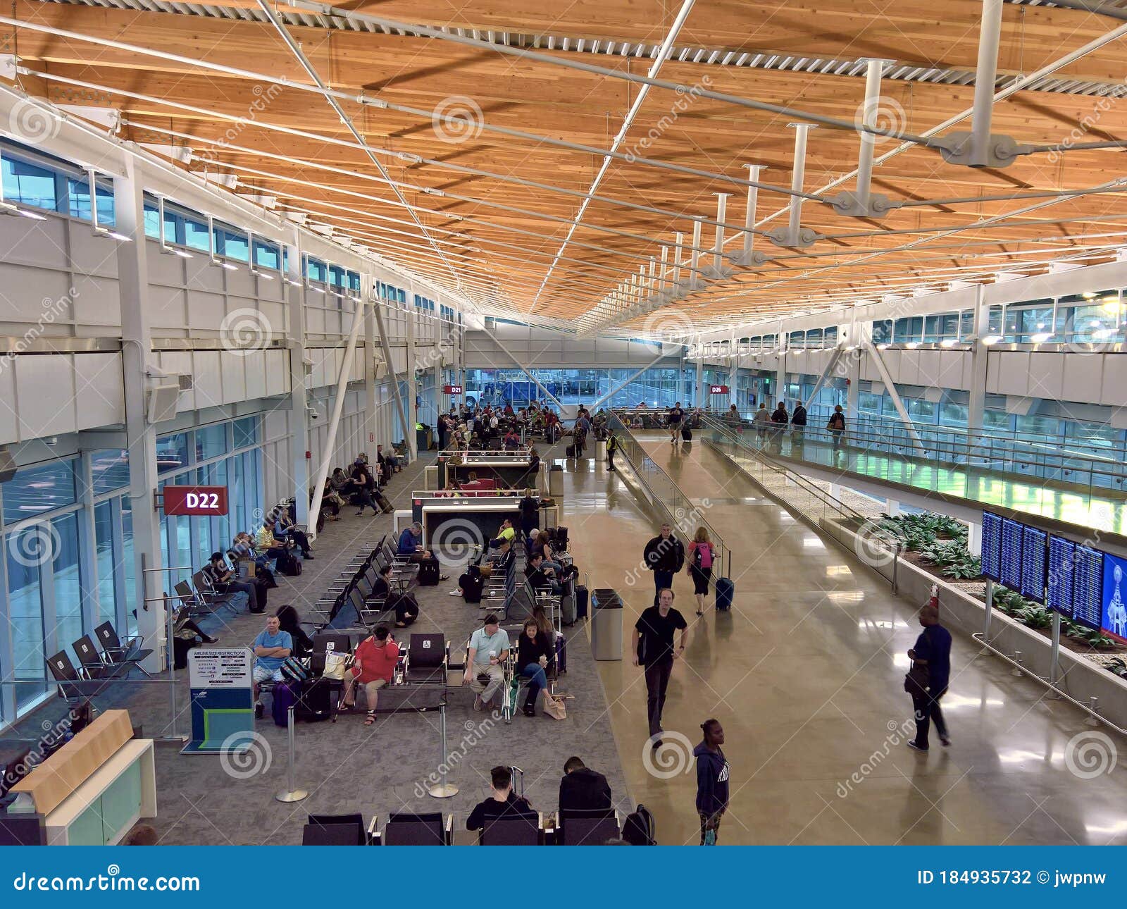 Passengers Wait For Their Flights Inside The Daniel K. Inouye