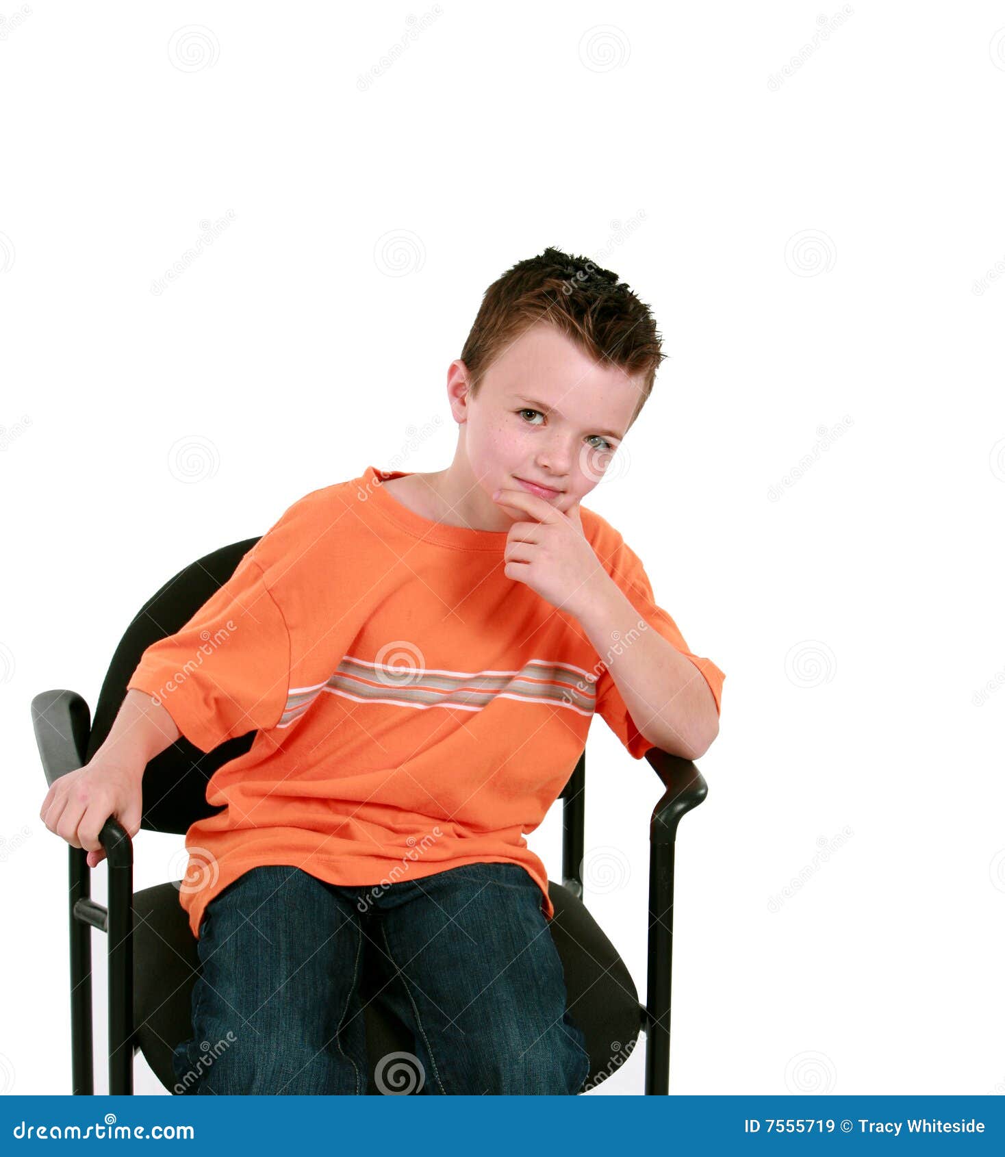 Seated boy in orange shirt stock image. Image of freckles 7555719