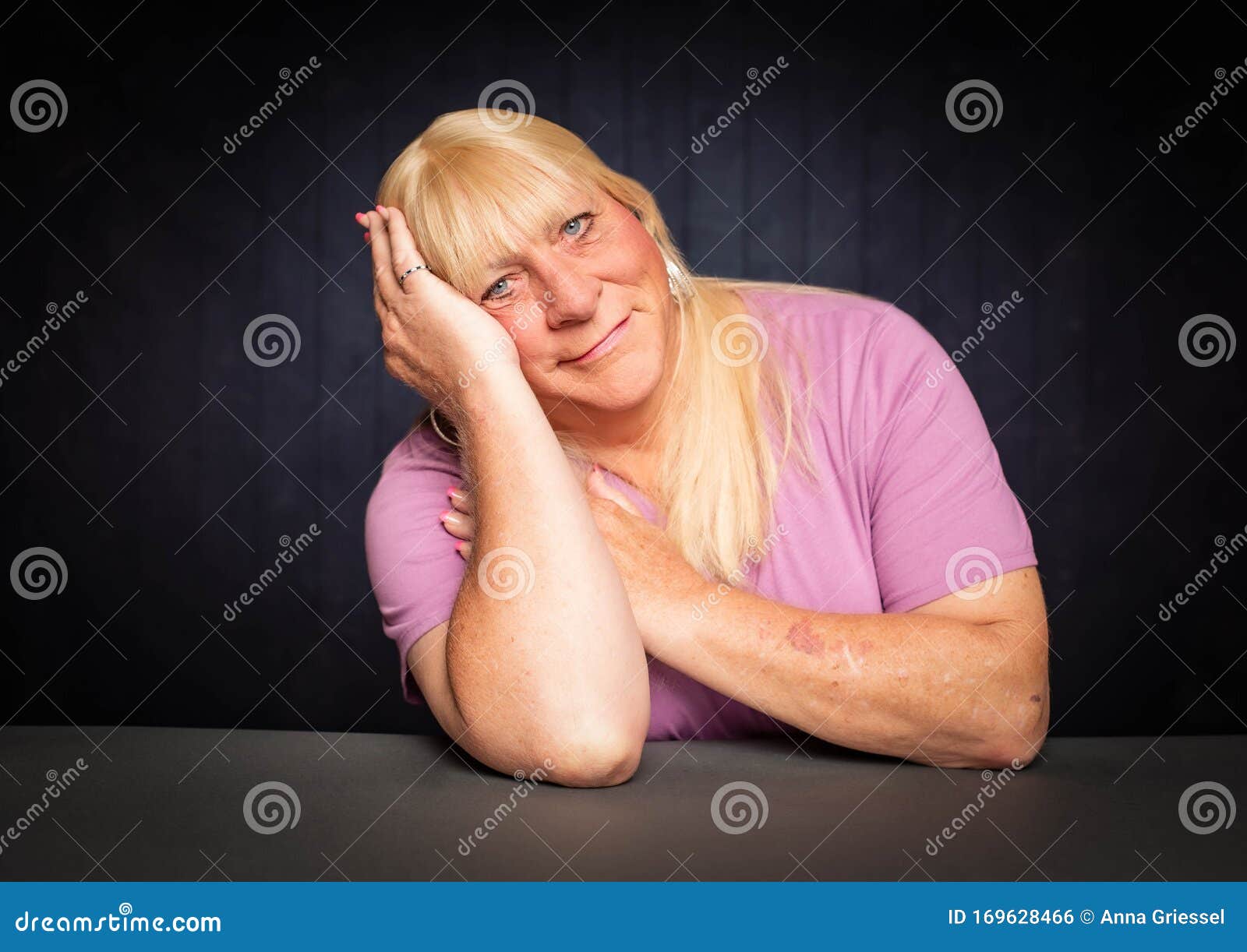 trans woman with head resting on her hand