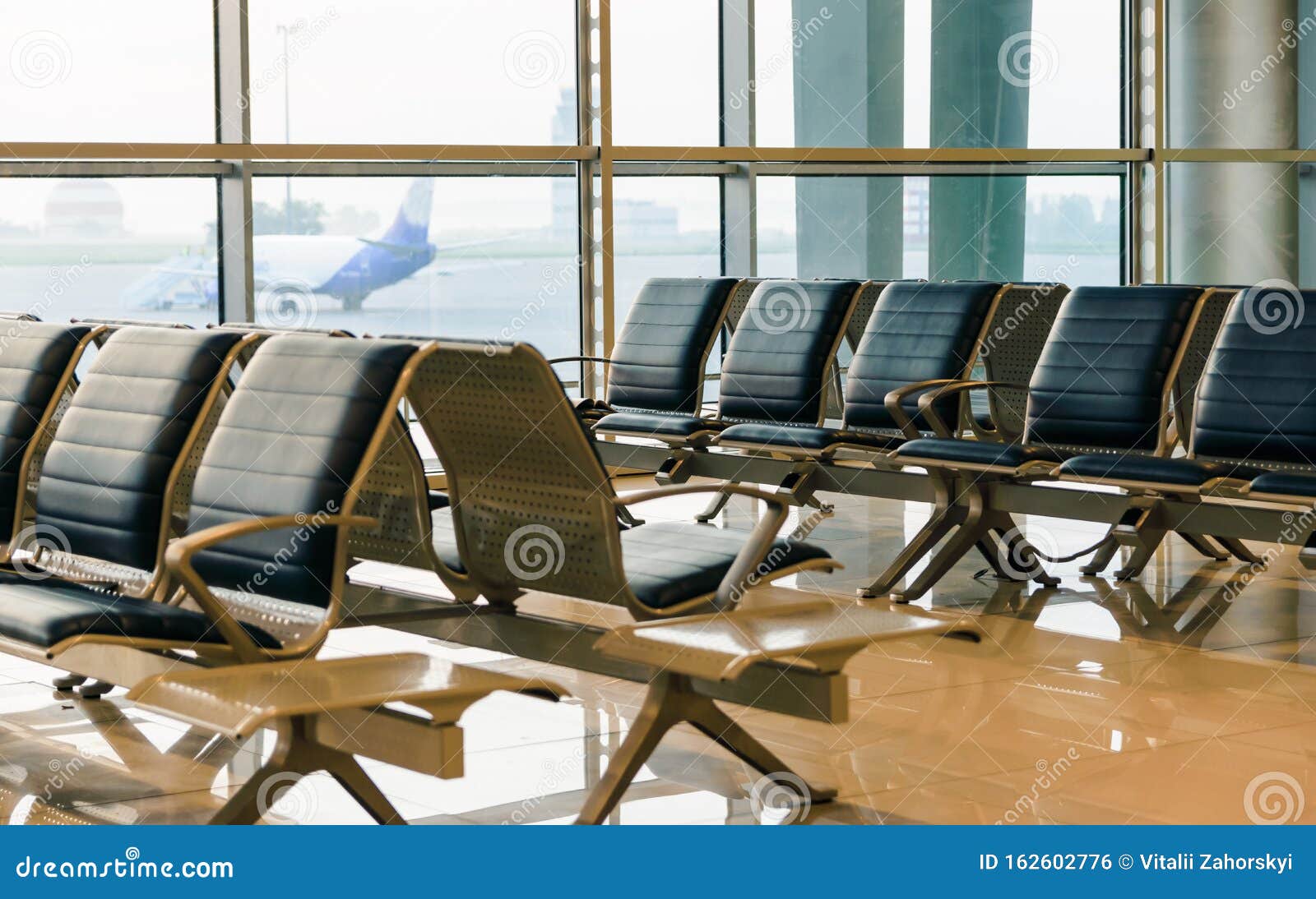 Concept Of Travel Seats In The Airport Lounge In The Rays Of The