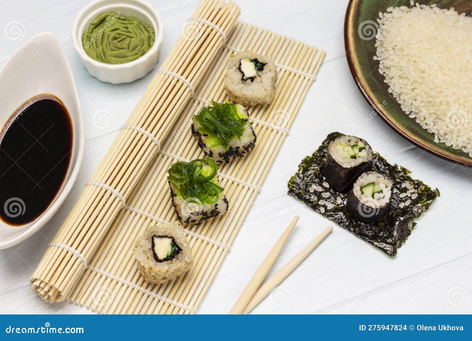 https://thumbs.dreamstime.com/z/seaweed-sushi-set-bamboo-mat-wasabi-soy-sauce-bowls-rice-plate-cucumber-nori-sheet-flat-lay-white-background-275947824.jpg