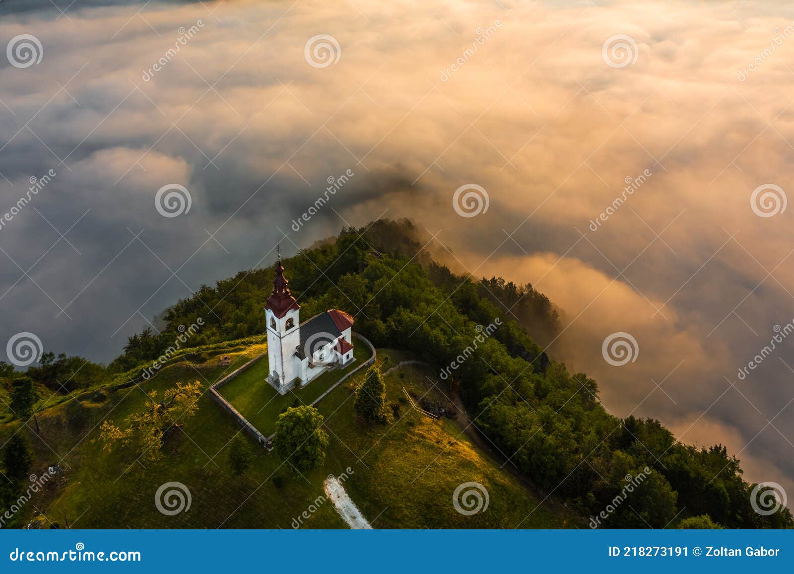 sebrelje, slovenia - aerial drone view of the beautiful hilltop church of st.ivan sv. ivan cerkev at sunrise
