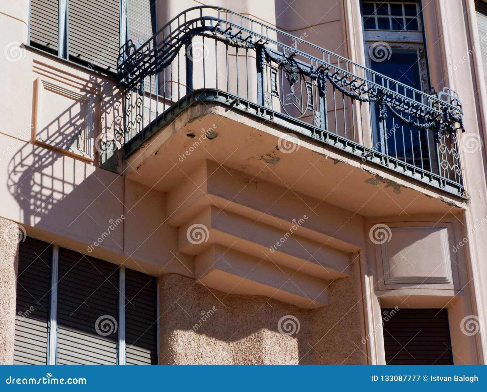 secessionist style facade detail with balcony and green window