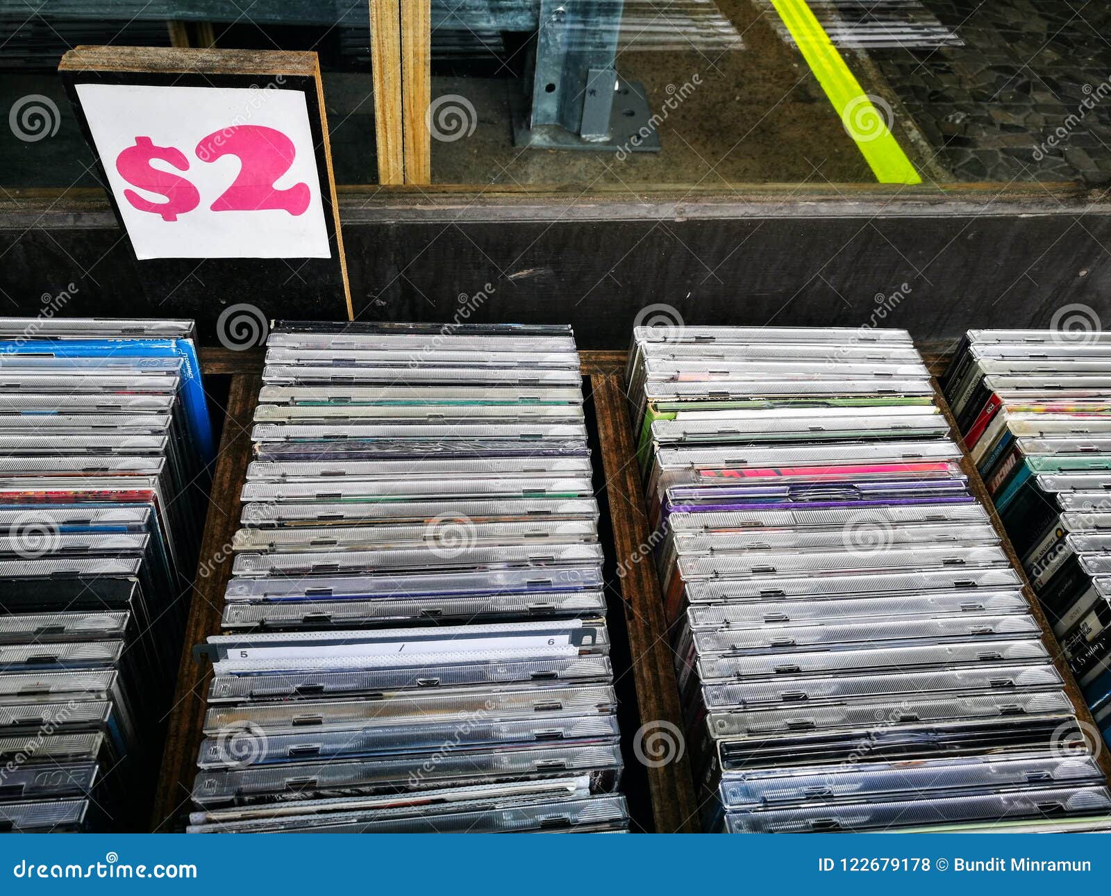 Secondhand CD Music Albums Sale for 2 Dollars Each. Stock Photo - Image