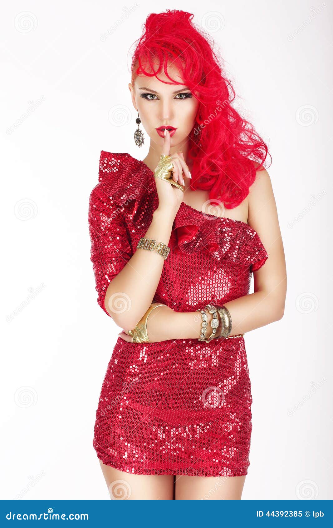 secret. posh woman with red hair and dress showing silence sign. shush!