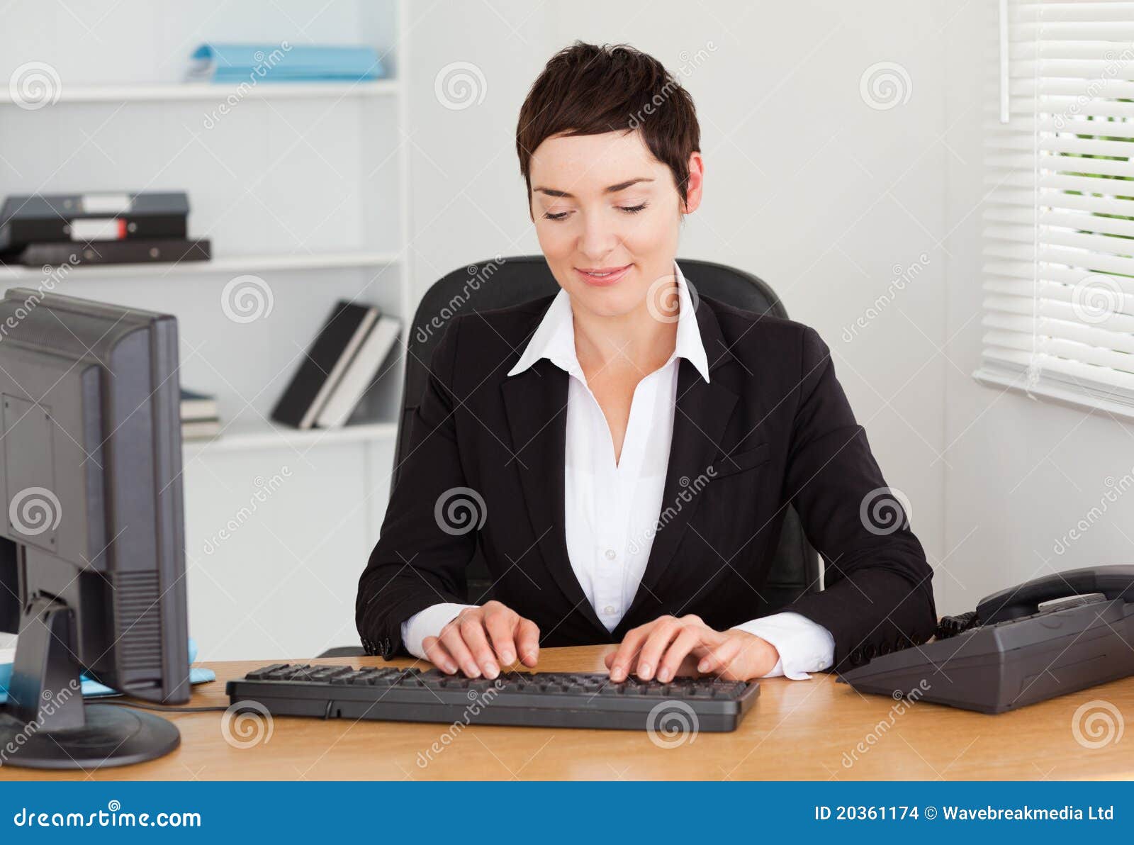 Secretary Typing On Her Keybord Stock Images - Image: 20361174