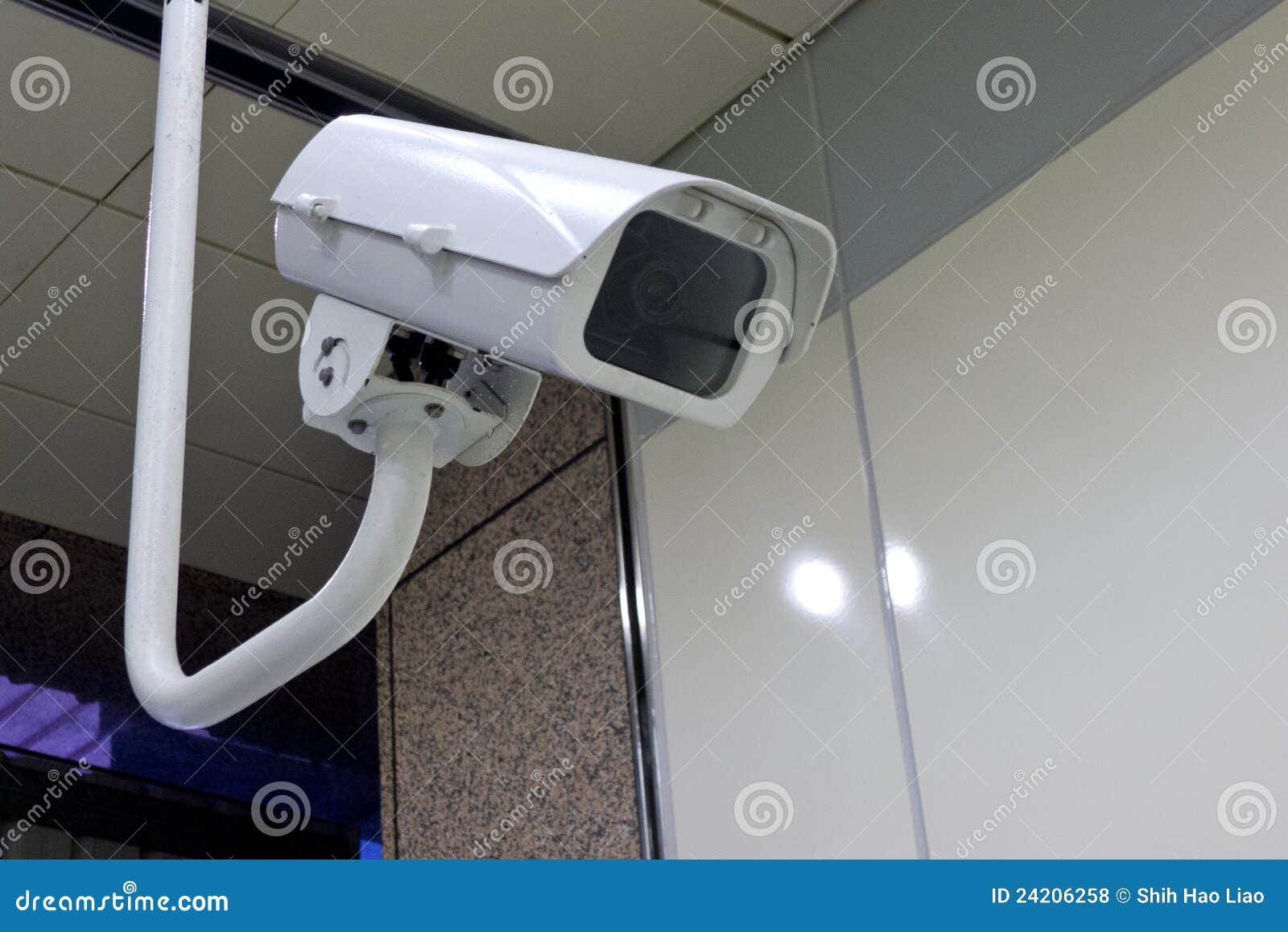 Security camera on wall in public space