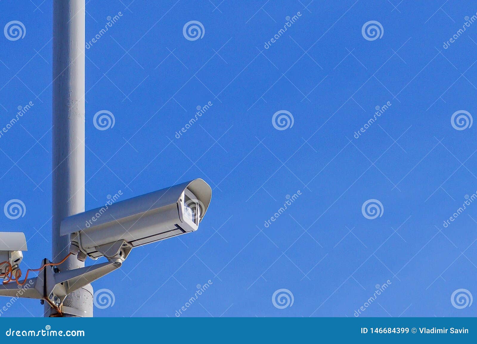 Security Camera Against the Blue Sky are Monitoring Stock Image Image