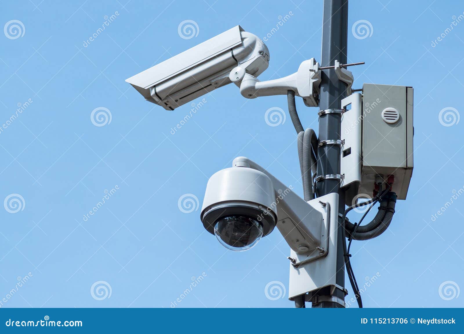 Security Camera in the City on Blue Sky Background Stock Photo Image