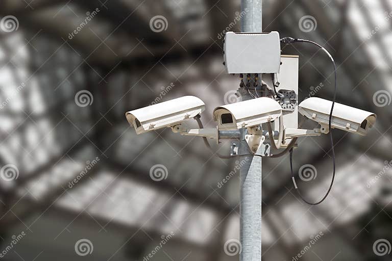 Security Cameras with Blurry Modern Building Background Stock Image Image of privacy, observe