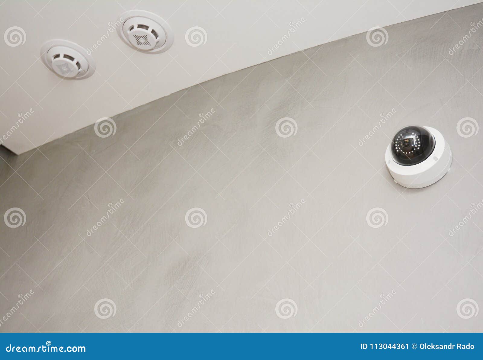 security cctv camera is mounted on the room wall with fire alarm system, fire detection