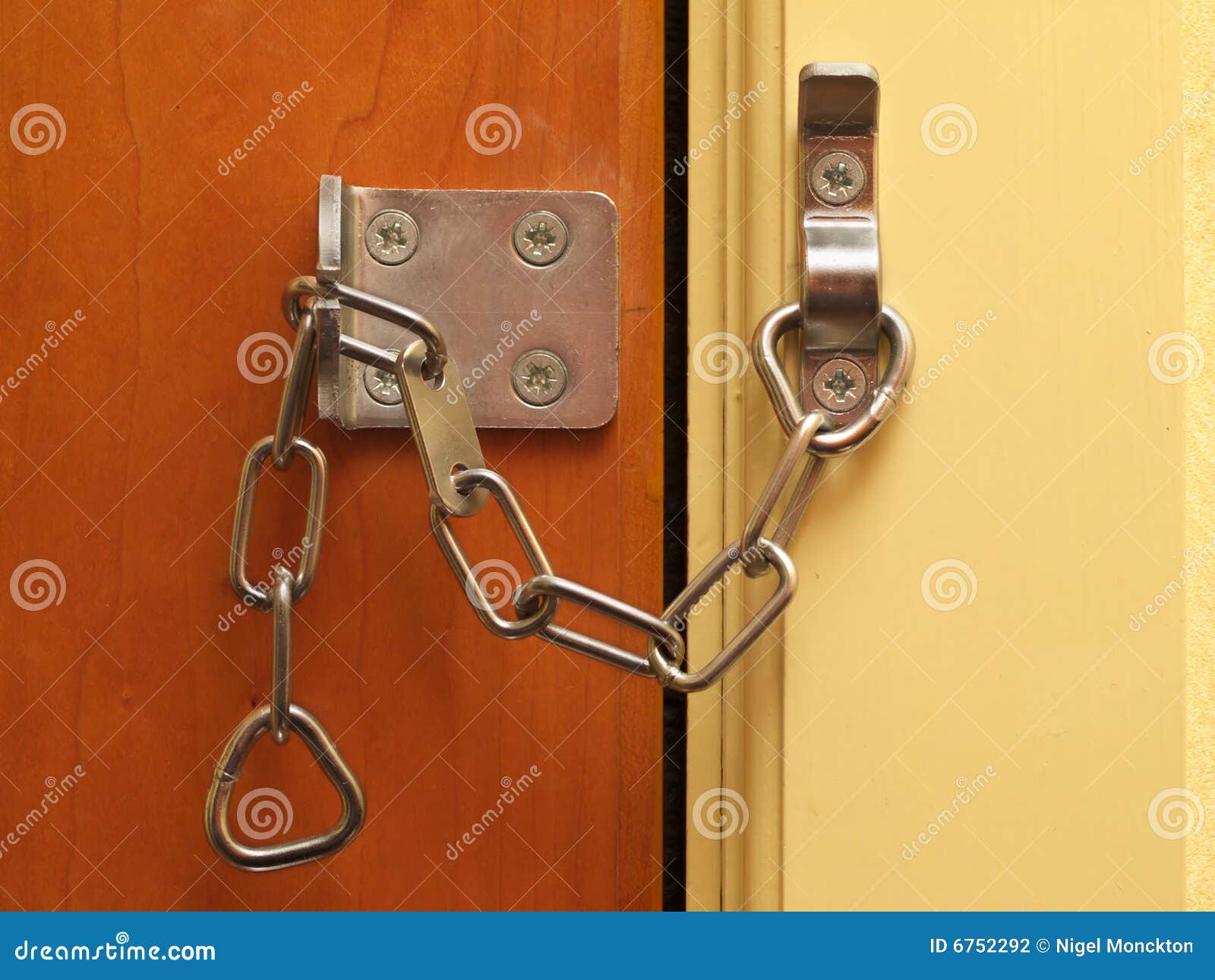 Security chain on a door stock photo. Image of safety 6752292