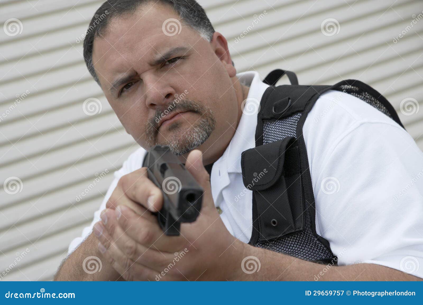 security guard in bulletproof vest holding gun