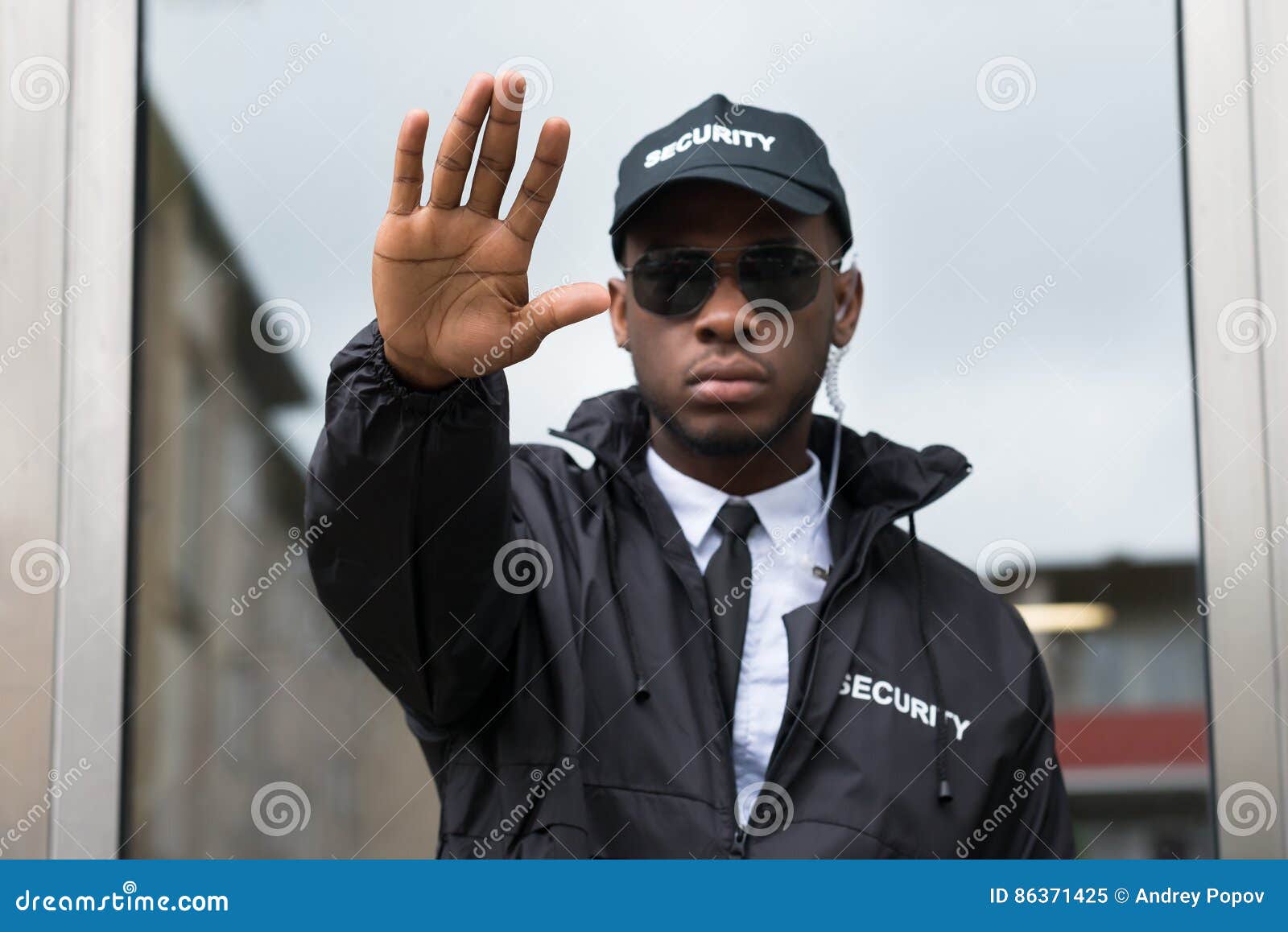 security guard making stop gesture